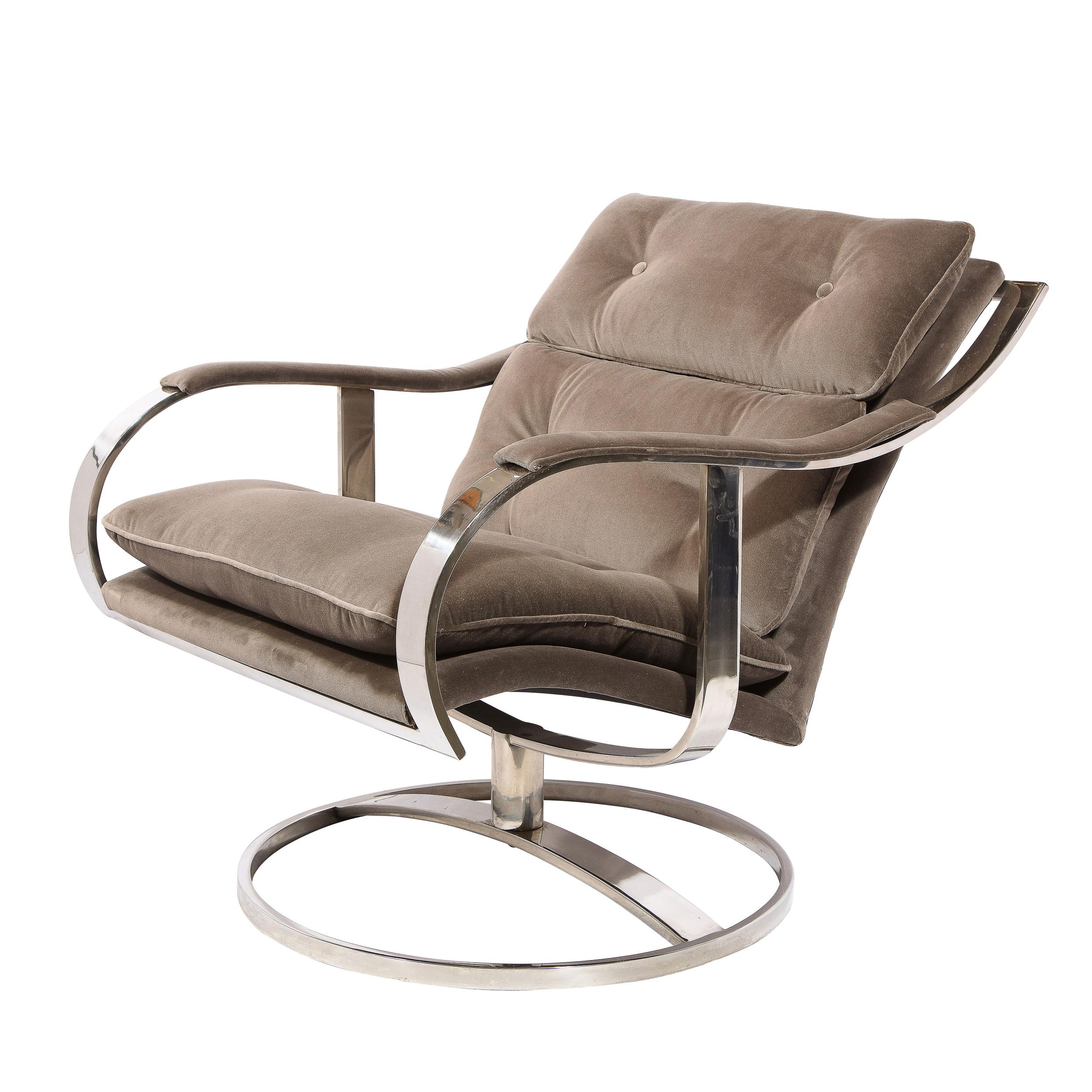 This stunning and sculptural pair of button back swivel arm/ lounge chairs were realized in the United States circa 1970. They feature circular bases bisected by a convex rectangular support - in lustrous polished chrome- which connects to the base