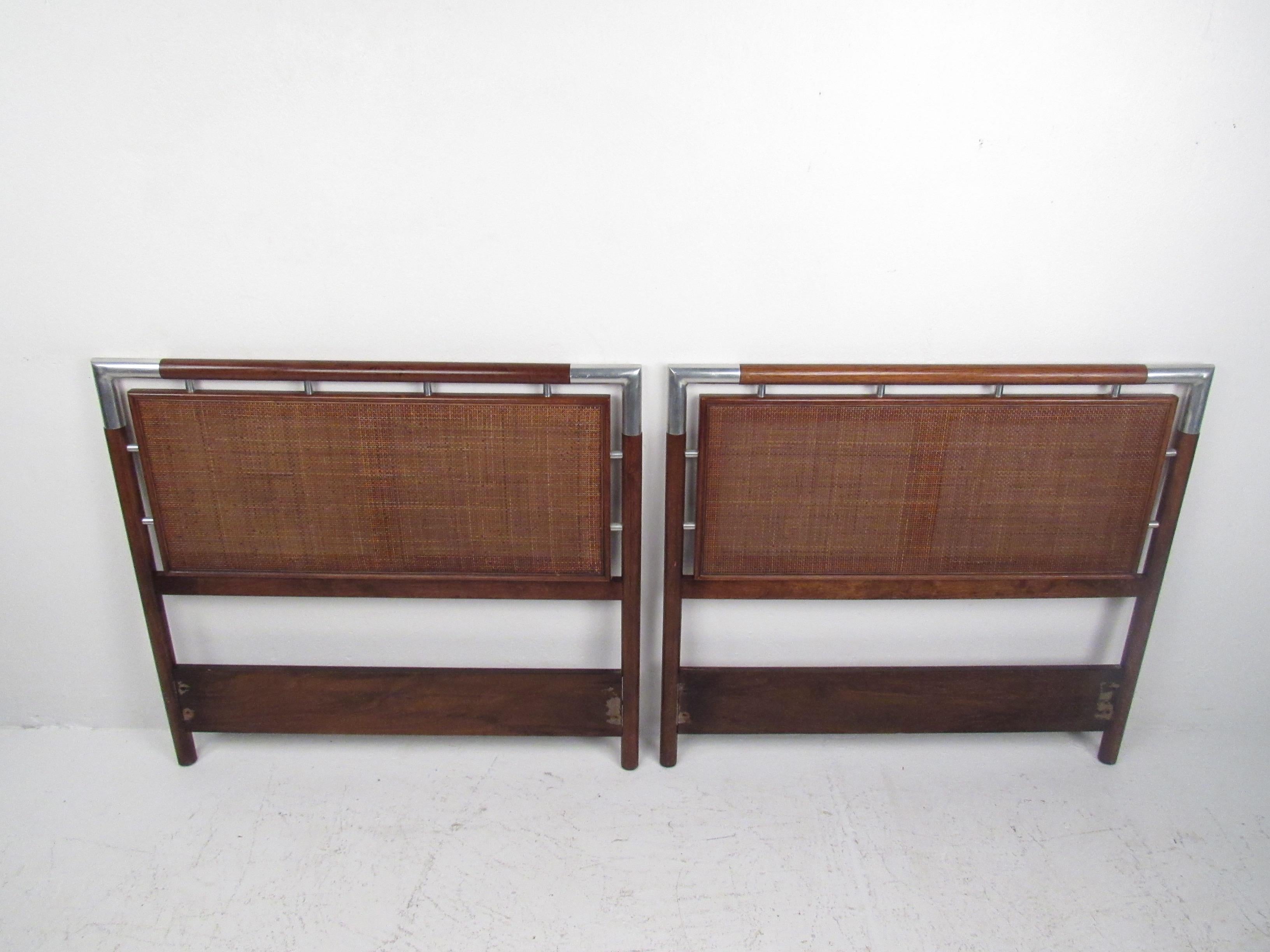 This vintage modern pair of headboards features a unique Mid-Century design with woven cane and chrome details. Can be used for a pair of children's beds or as a 