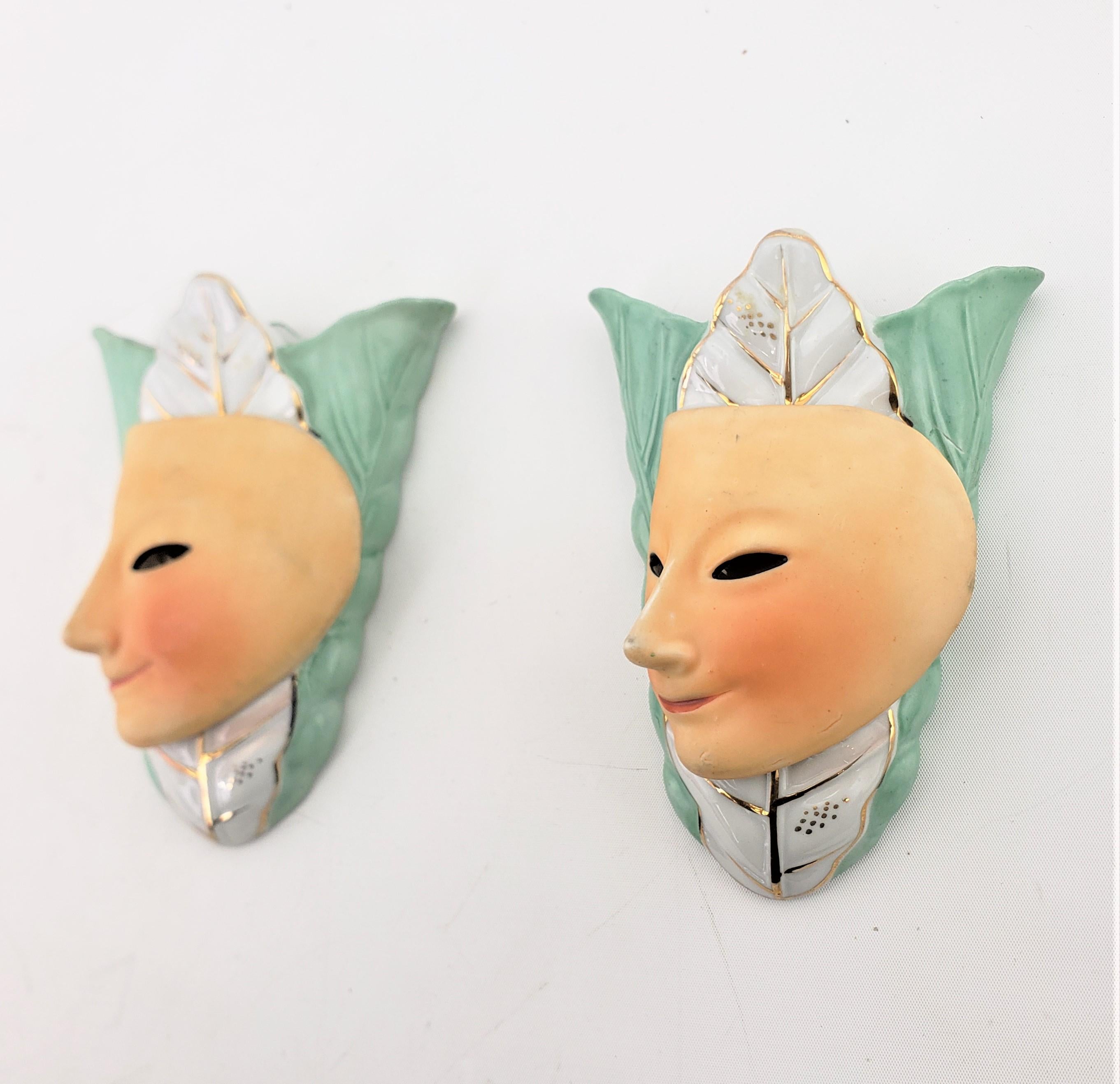 Glazed Pair of Mid-Century Modern Ceramic Wall Pockets with Harlequin Mask Alien Faces For Sale