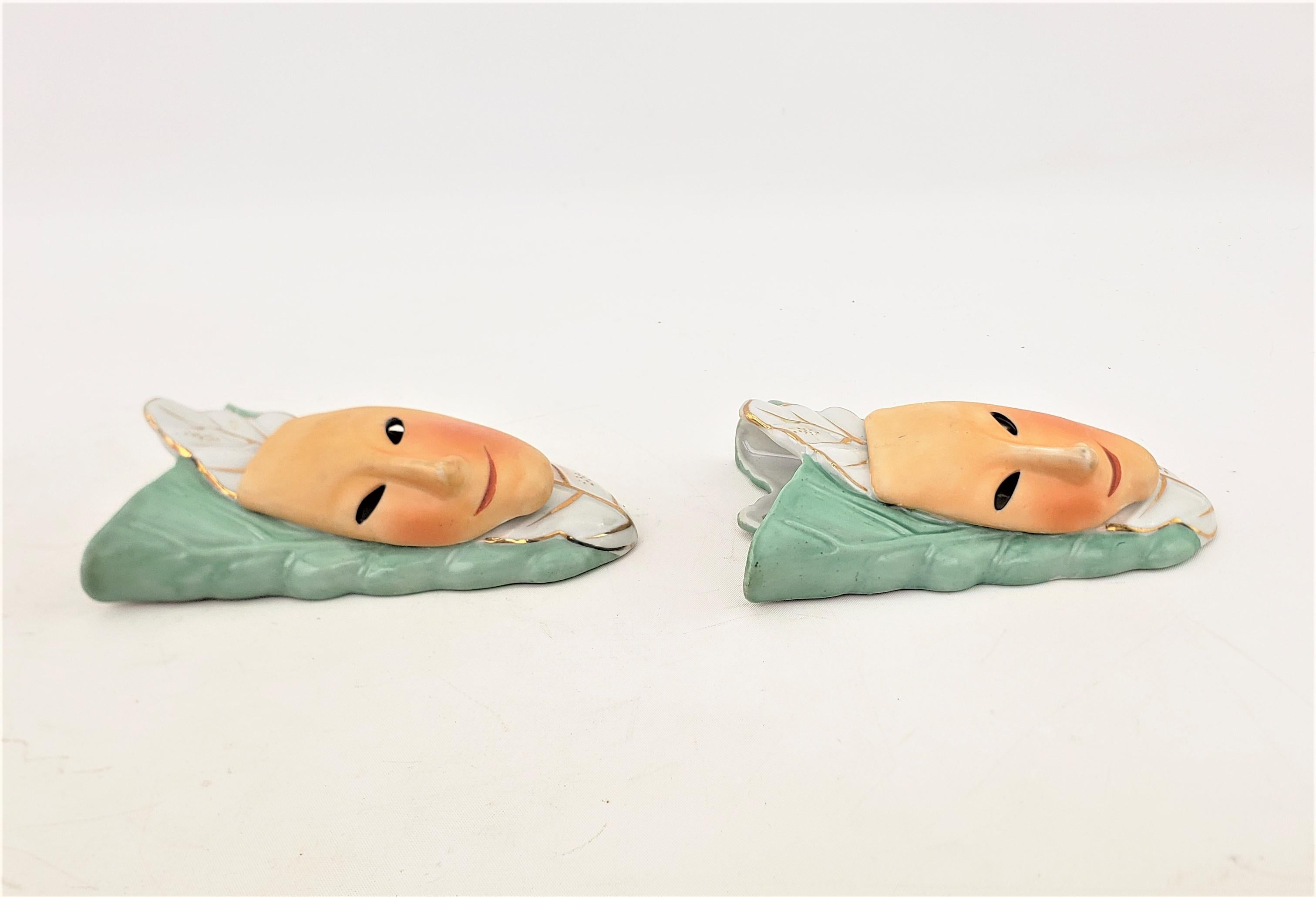 20th Century Pair of Mid-Century Modern Ceramic Wall Pockets with Harlequin Mask Alien Faces For Sale