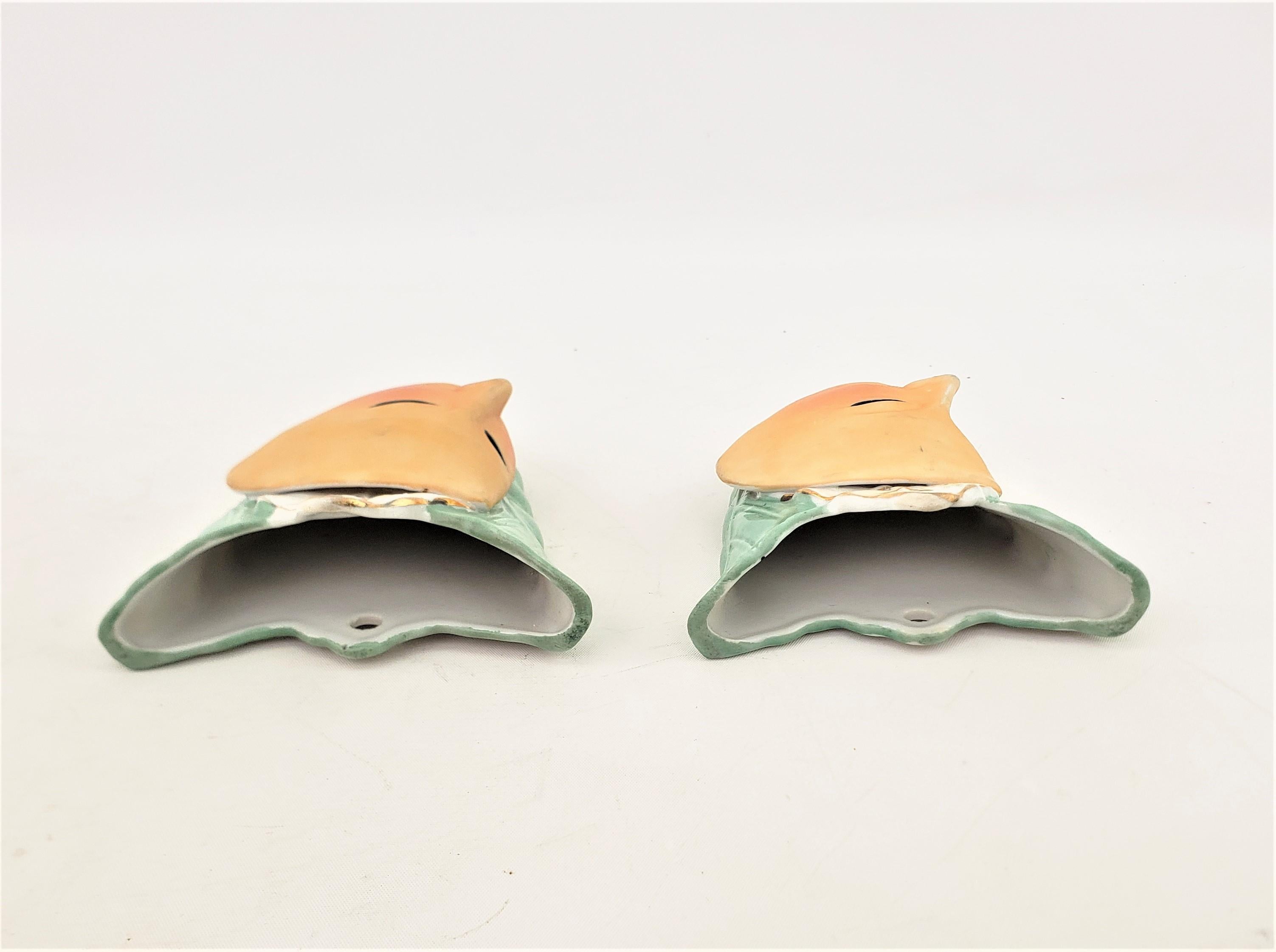 Pair of Mid-Century Modern Ceramic Wall Pockets with Harlequin Mask Alien Faces For Sale 1
