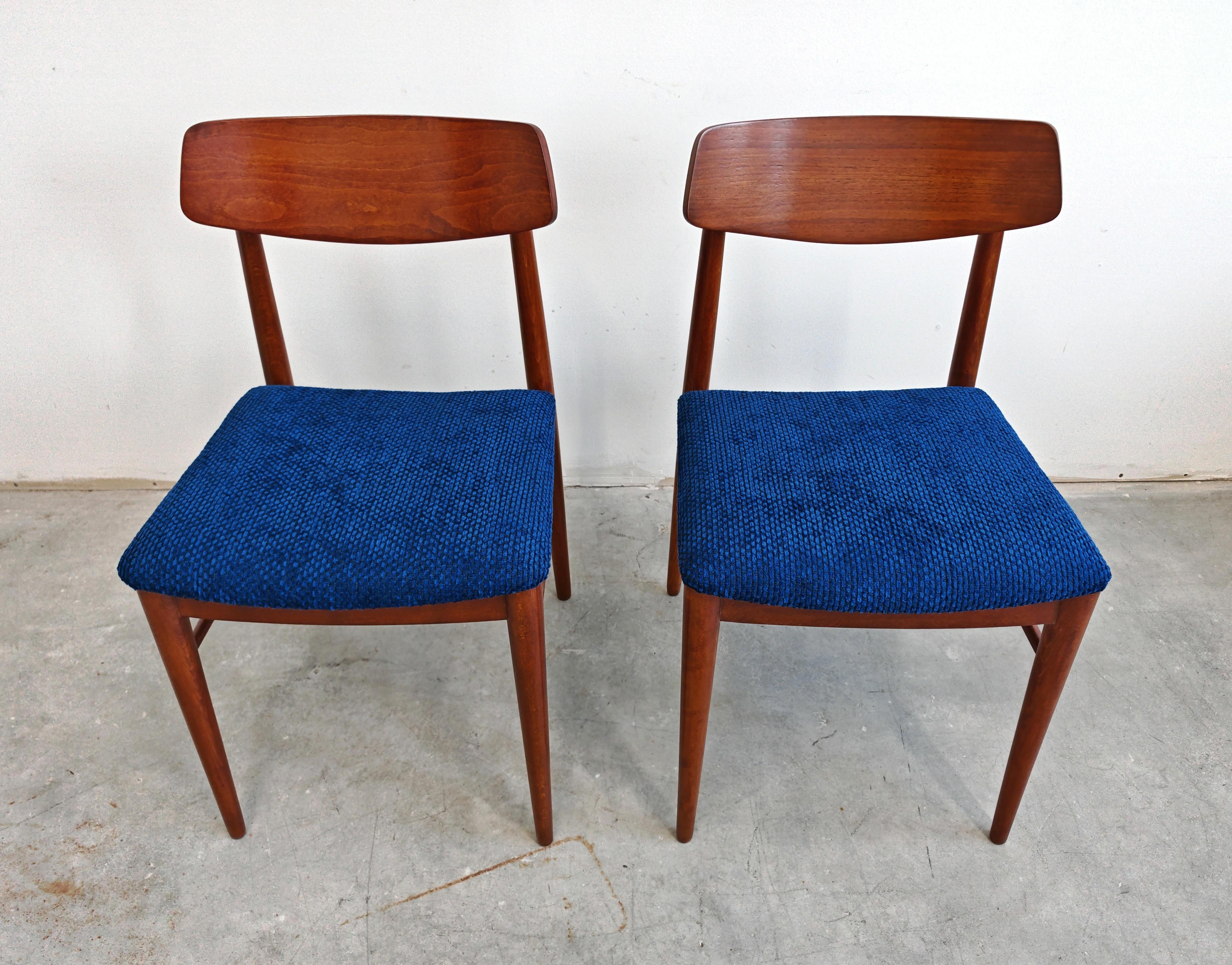 In this listing you will find a pair of stunning and very rare Mid Century Modern dining chairs designed by Josef Frank for Wiesner Hager. The chairs have been refurbished and reupholstered in royal blue textured fabric. Made in Austria in the