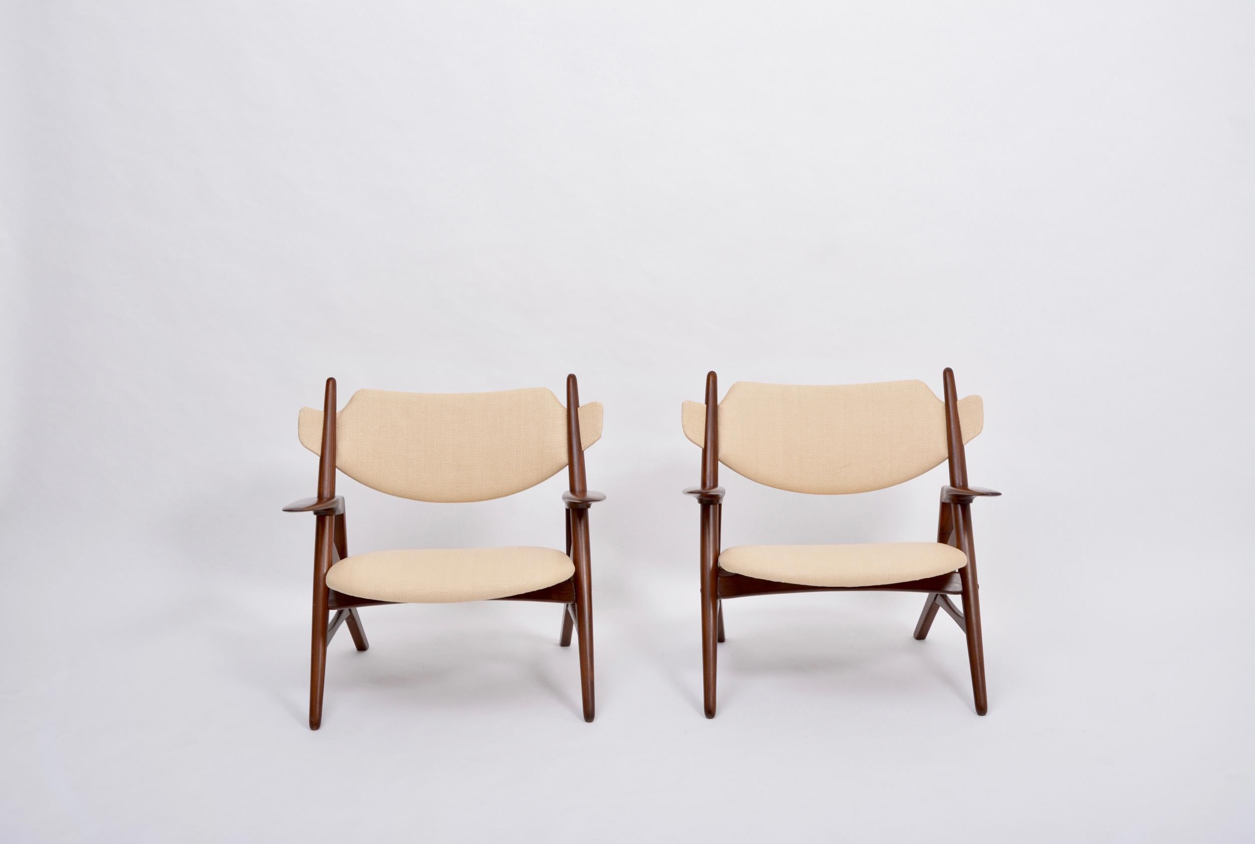 Pair of Reupholstered Mid-Century Modern chairs 
Pair of gorgeous Mid-Century Modern graphic wooden chairs produced in the 1950s.
The chairs were purchased in an auction in Italy.
The structures are made of wood, the seat and backrest have been