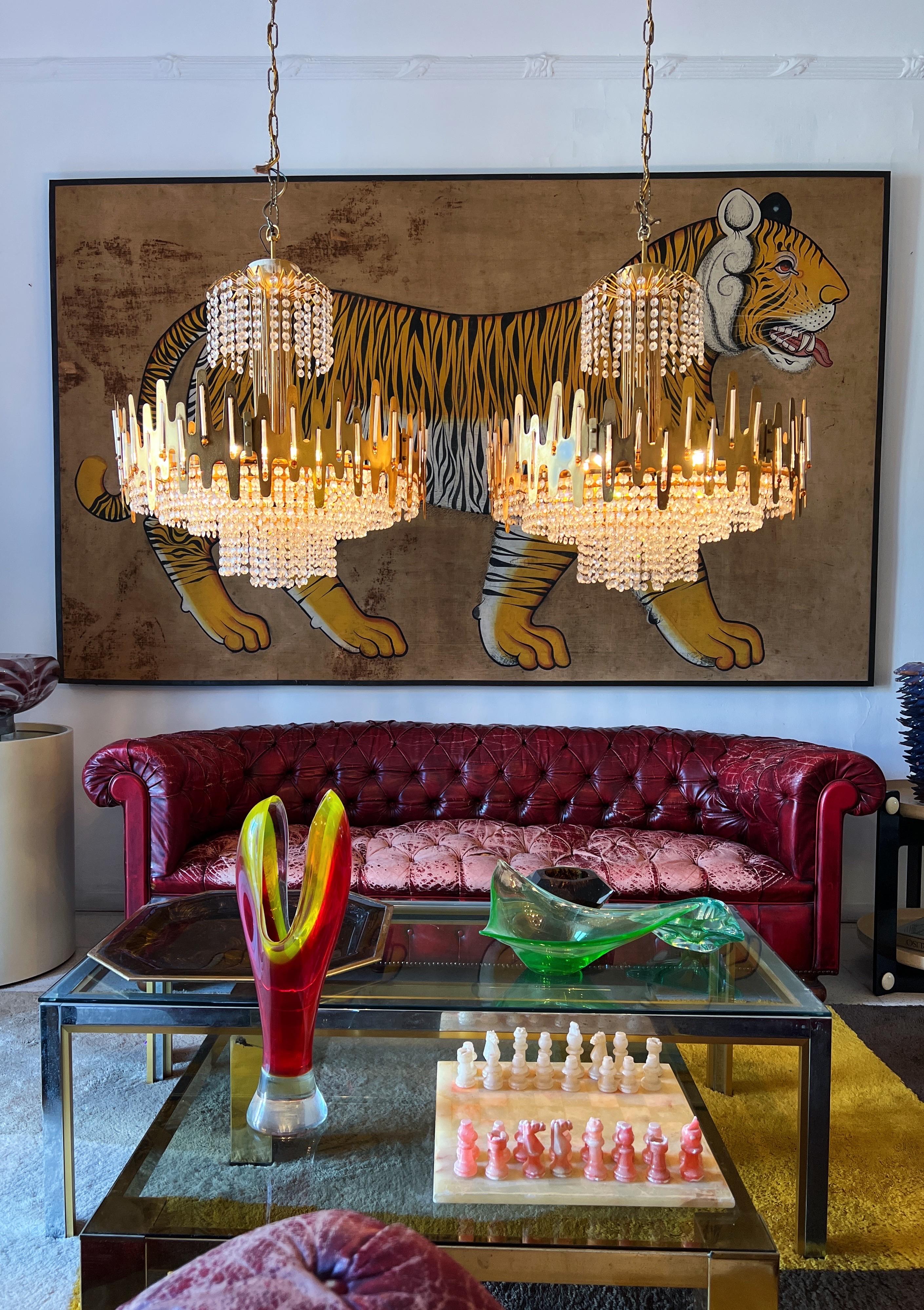Experience the Magnificence of these 1970s Italian Chandeliers by Sciolari. 

These luminous treasures are not just fixtures; they are the crowning jewels of any room fortunate enough to bask in their glow.

Constructed with meticulous