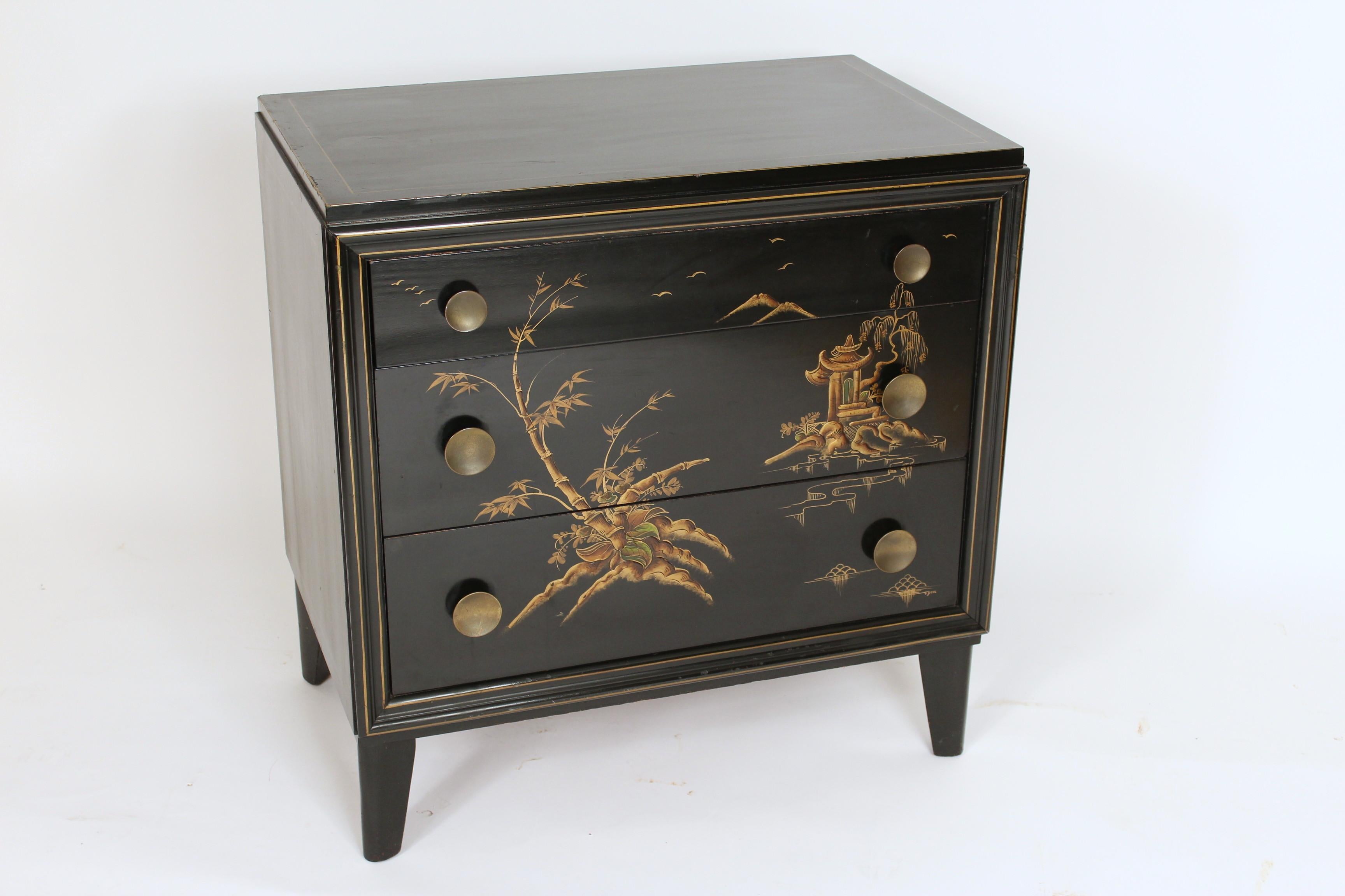 Pair of Mid-Century Modern chinoiserie decorated black lacquer two drawer chests of drawers, circa 1950s. With raised chinoiserie decorations, brass knobs and signed P. Deeg.