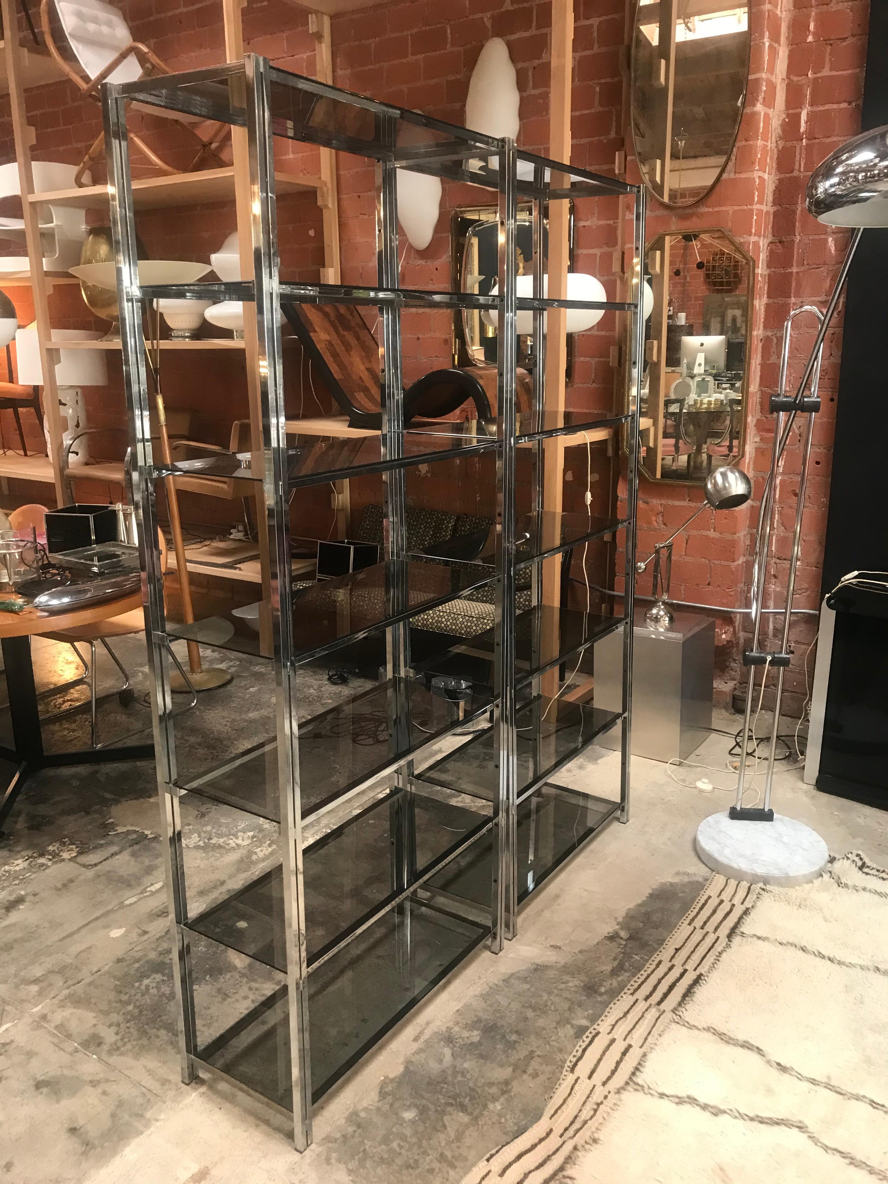 Pair of Mid-Century Modern chrome étagère with six glass shelves.
Minimalist look but great storage. Clean, sophisticated lines make this a Classic for all designs.
The dimensions above are regarding each bookcase.
