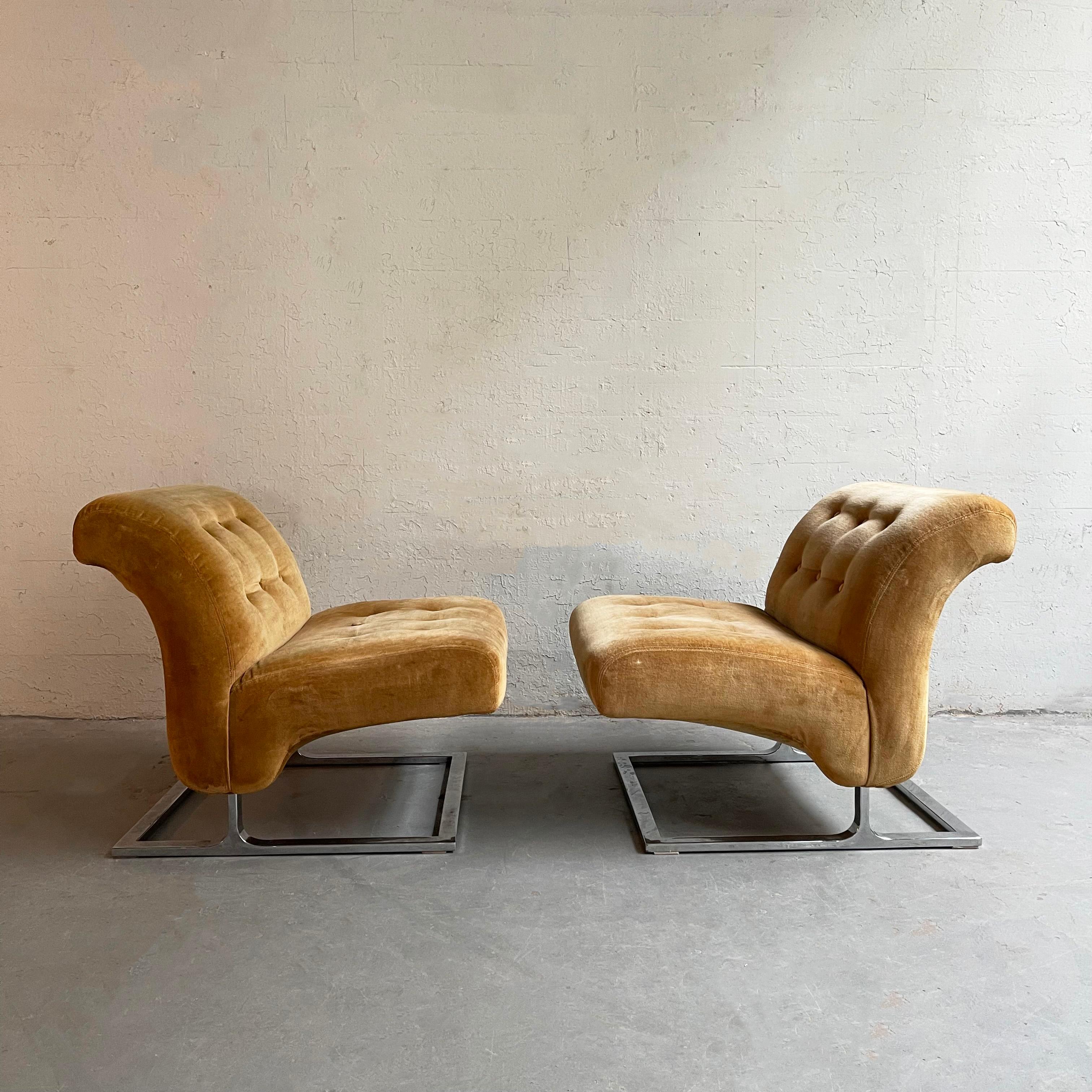 Pair of incredibly sexy, late mid-century modern, slipper, lounge chairs in the style of Milo Baughman feature curvaceous, tulip-shaped bodies on flat bar chrome, cantilever bases. The original teddy bear tan, velvet upholstery is button tufted on