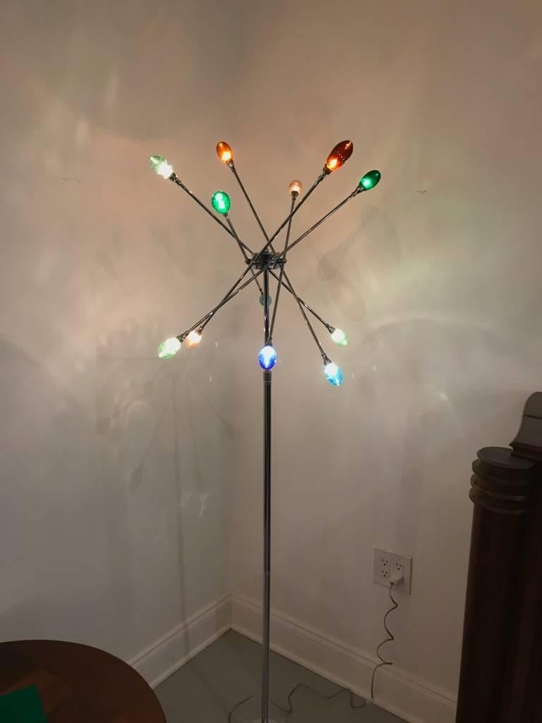 Pair of Mid-Century Modern chrome Sputnik floor lamps. Having adjustable arms with both ends having multi colored glass shades. With chrome round base.