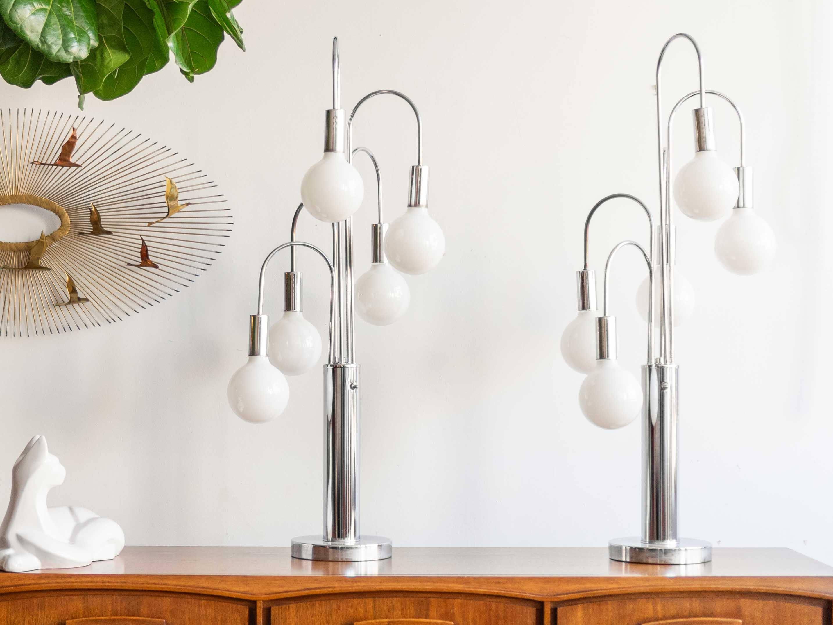 17” x 17” x 41”H

Pair of mid century modern chrome waterfall table lamps. Multiple settings allowing one to illuminate some or all of the bulbs. Light bounces beautifully off the ultra glam chrome surface of the lamps. Frequently attributed to