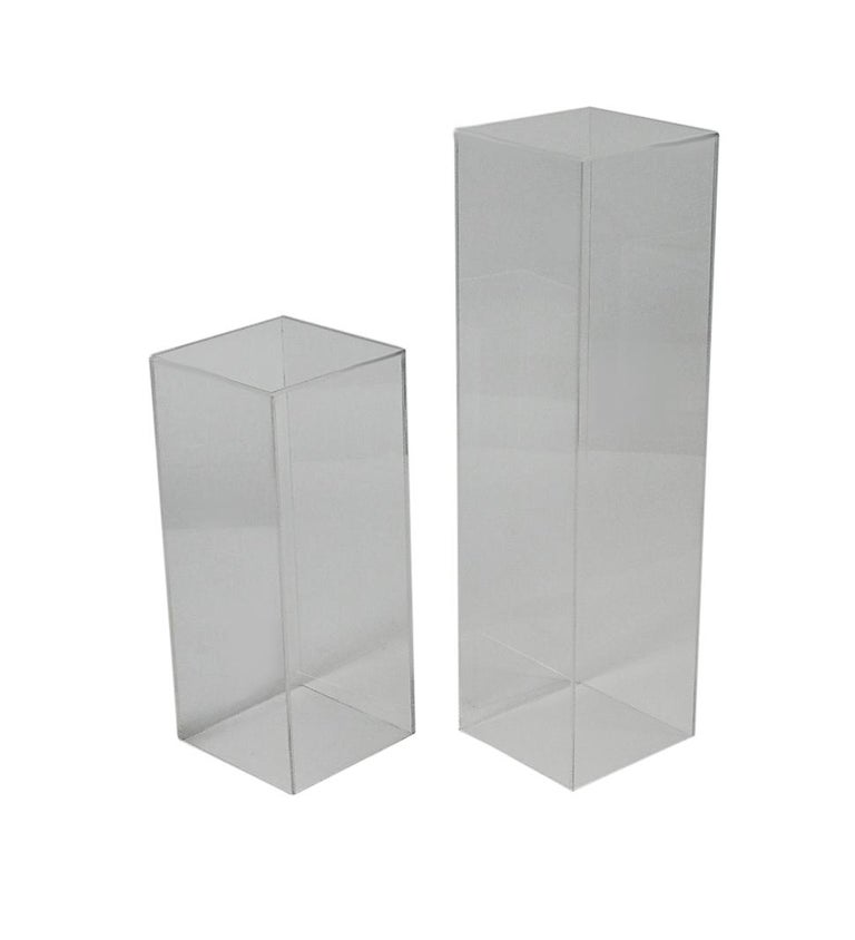 A simple matching pair of acrylic pedestals in 2 sizes. The taller measures 36 inches in height and the smaller measures 24 inches.