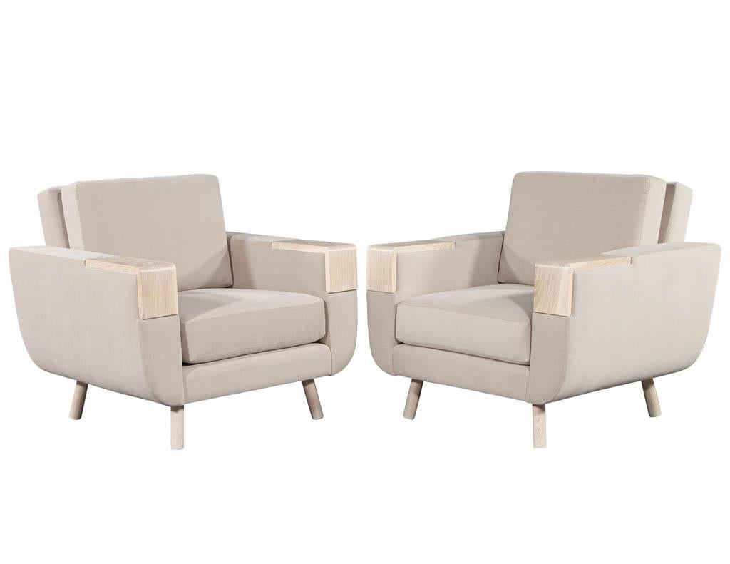 Mid-Century Modern club chairs with cerused oak accents finished in an acid wash finish. Upholstered in a designer beige velvet with comfortable thick cushion design.

Price includes complimentary curb side delivery to the continental USA.