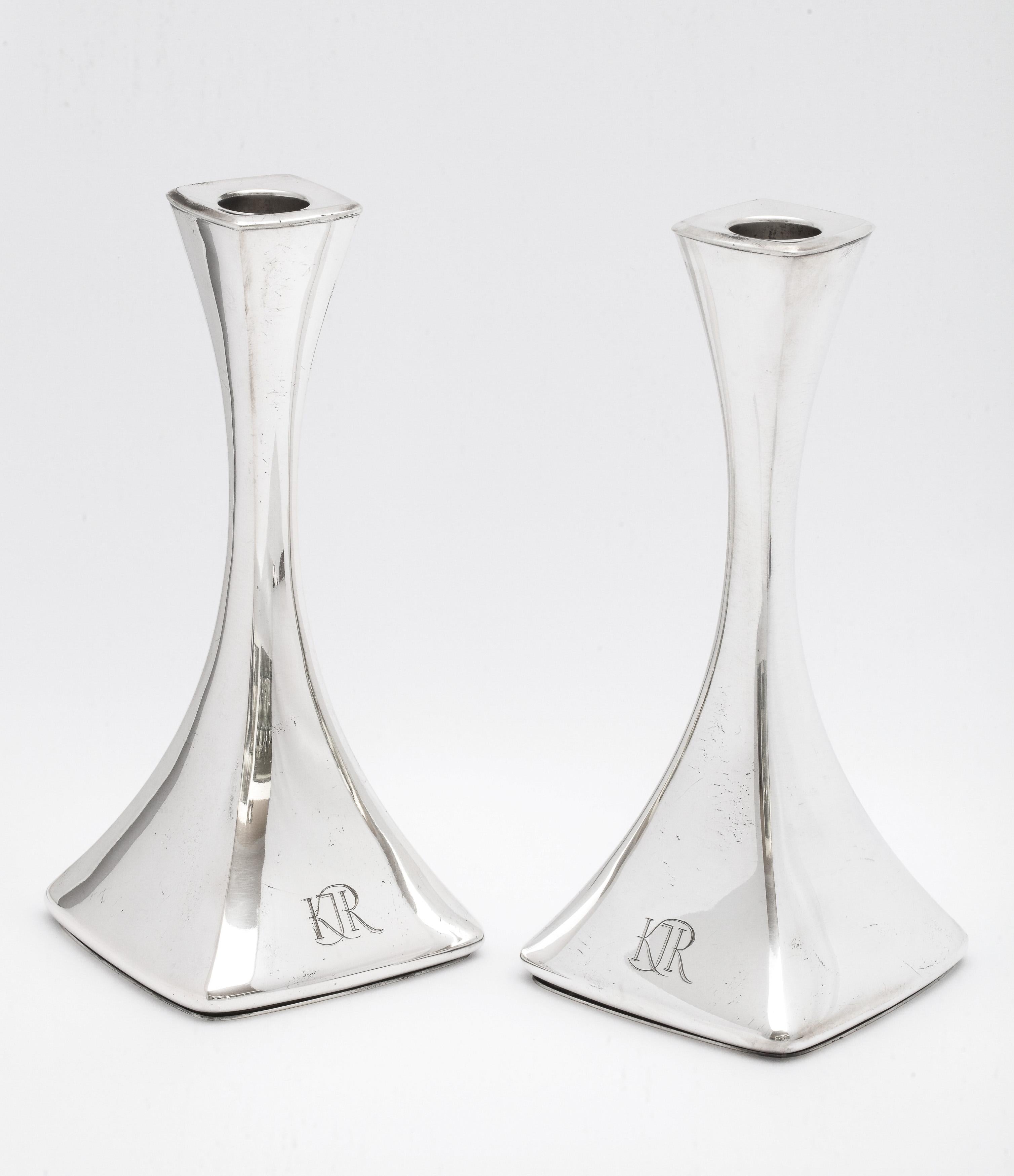 Pair of Continental silver, Mid-Century Modern candlesticks, Helsinki, Finland, year-hallmarked for 1964, Turku - maker. Each candlestick measures 7 inches high x 3 1/4 inches wide (at widest point) x 3 1/4 inches deep (at deepest point). Combined