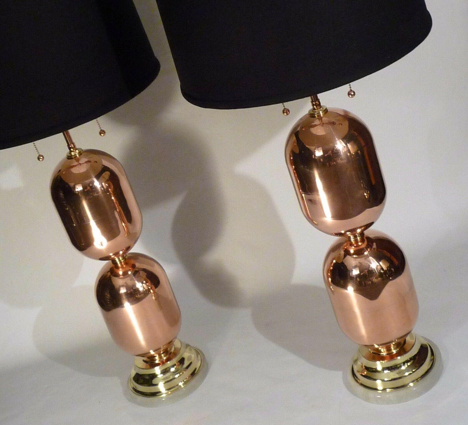 For your consideration is this pair of Mid Century solid copper capsule form brass accented architectural mid century table lamps in pristine condition. Re polished but not lacquered Measure 29.5