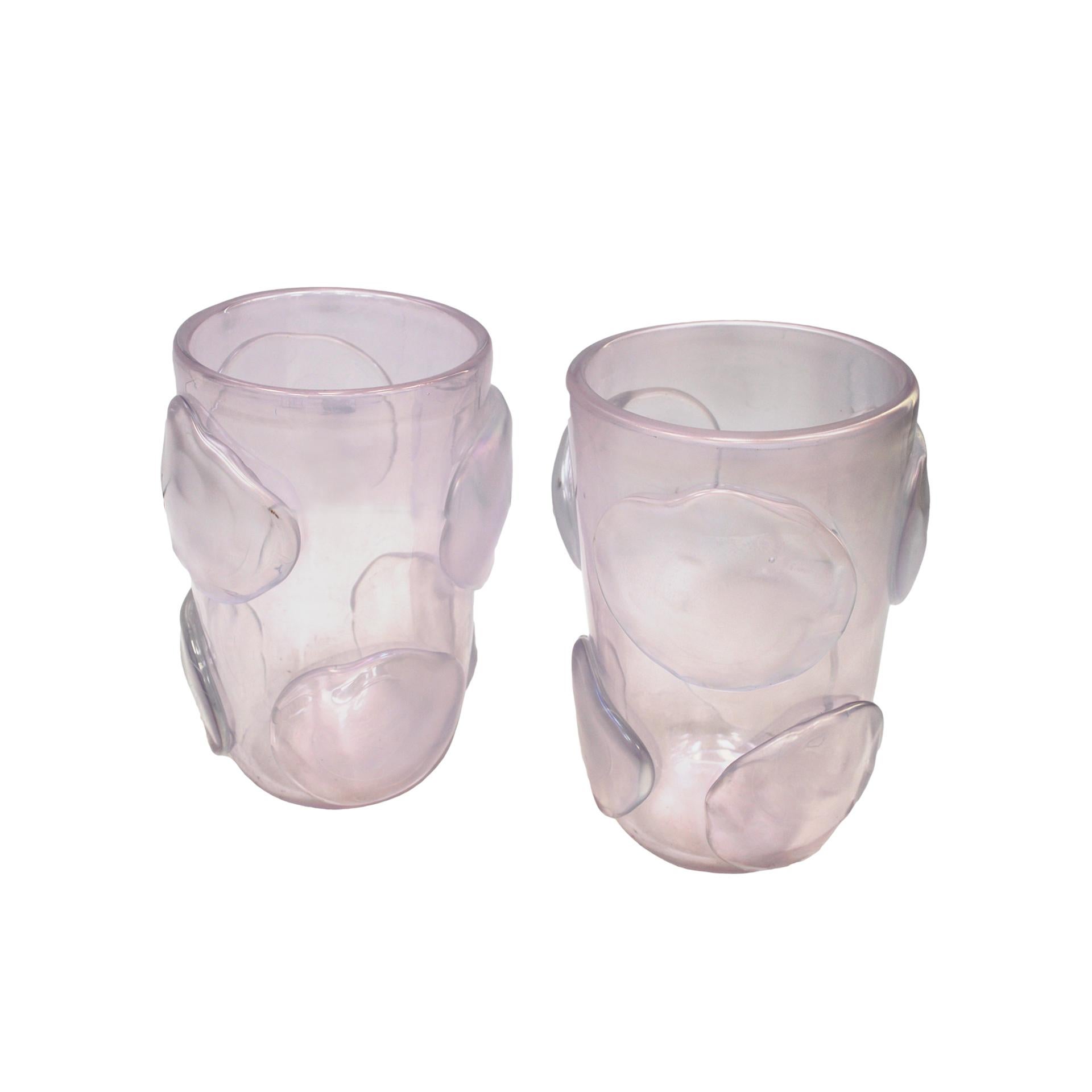This pair of Murano hand blown vases, crafted from opaline glass by Italian glassblower Costantini, exemplifies the intricate artistry of 1980s Venetian glassmaking. Adorned with round freeform reliefs, these pieces highlight the unique techniques