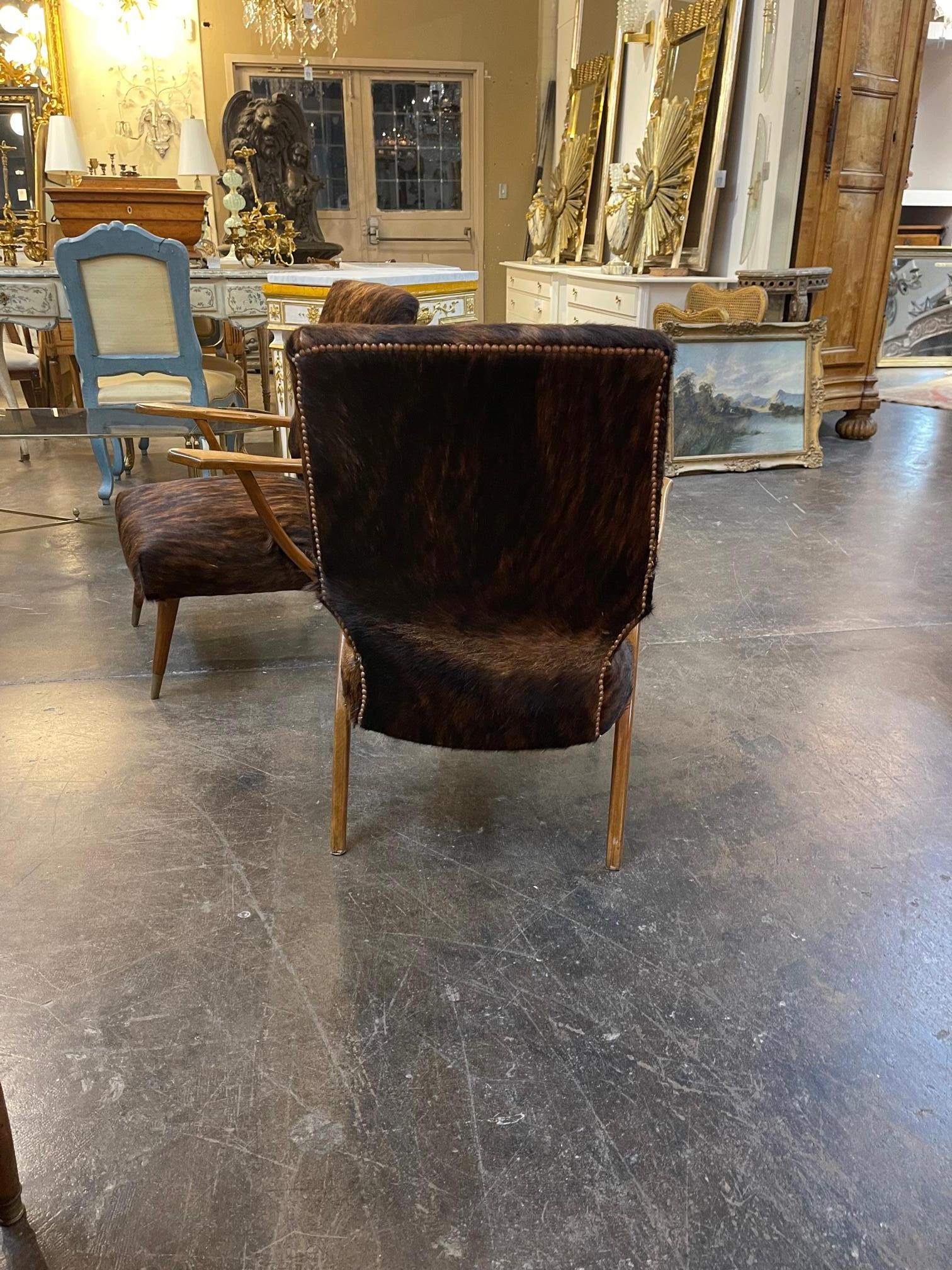 20th Century Pair of Mid-Century Modern Cowhide Covered Armchairs