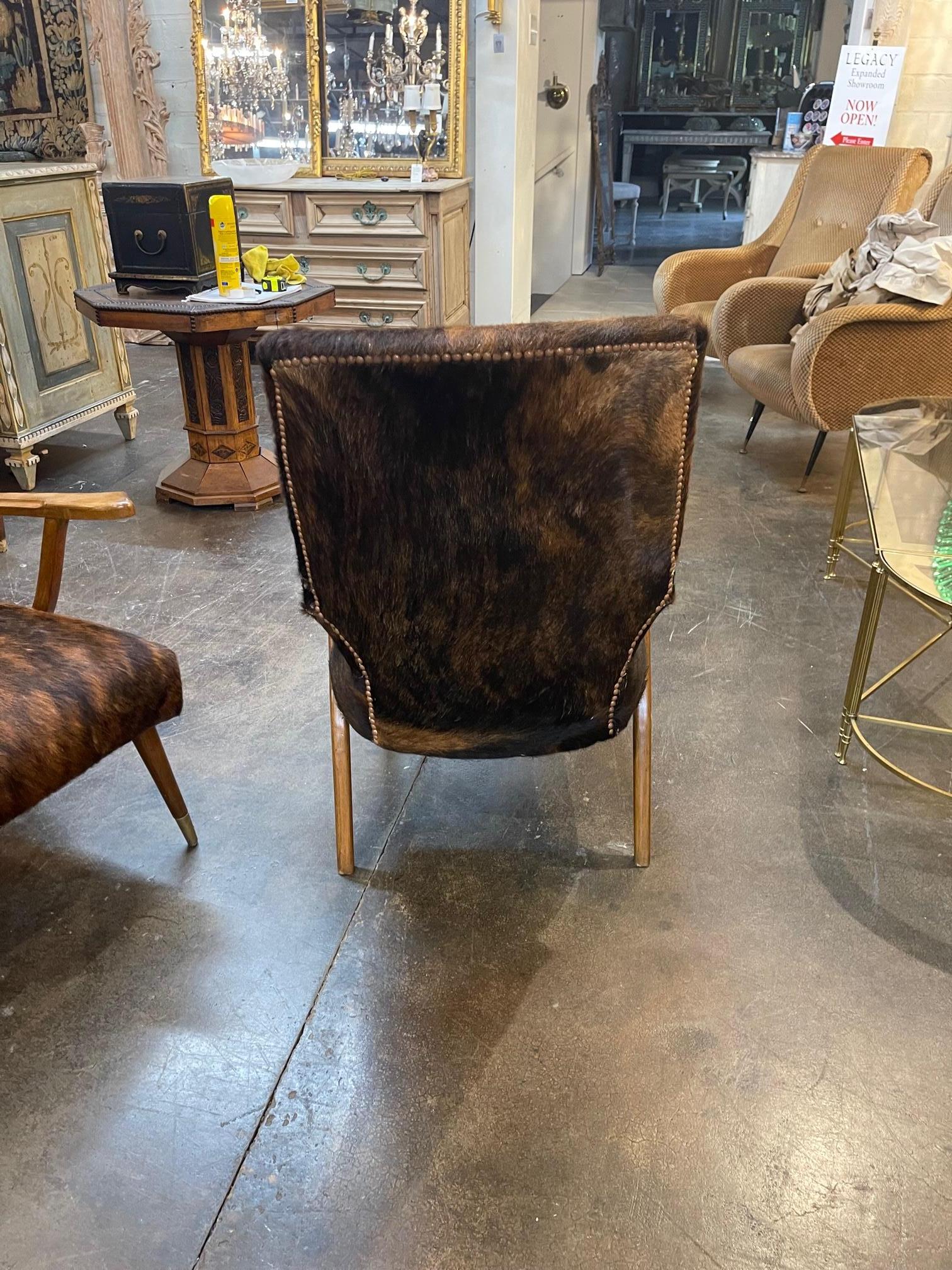 Pair of Mid-Century Modern Cowhide Covered Armchairs 1