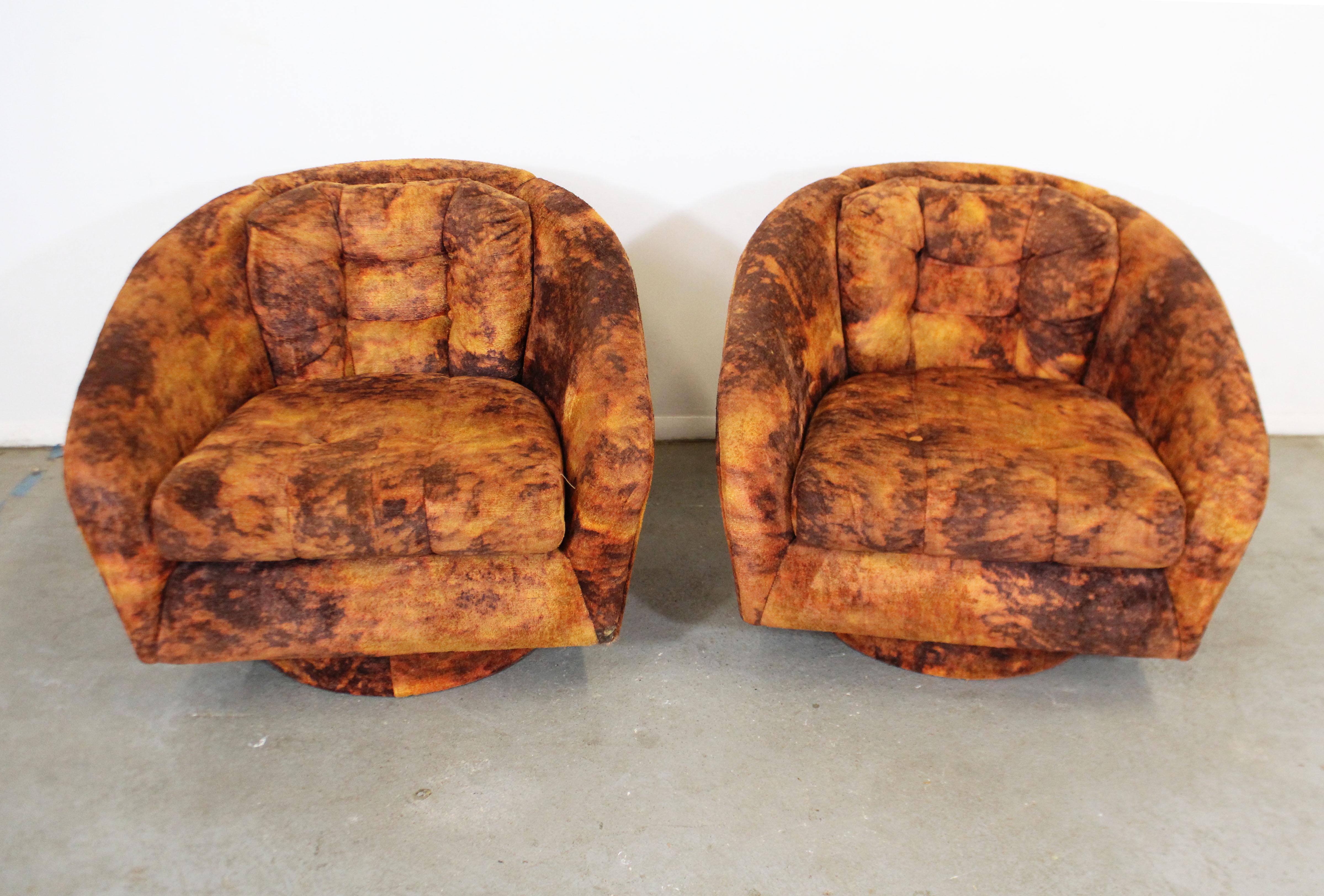 What a find. Offered is a pair of vintage Mid-Century Modern swivel chairs with groovy crushed velvet upholstery. These chairs scream quintessential Mid-Century Modern! They are in good condition for their age with some wear on the upholstery. Can