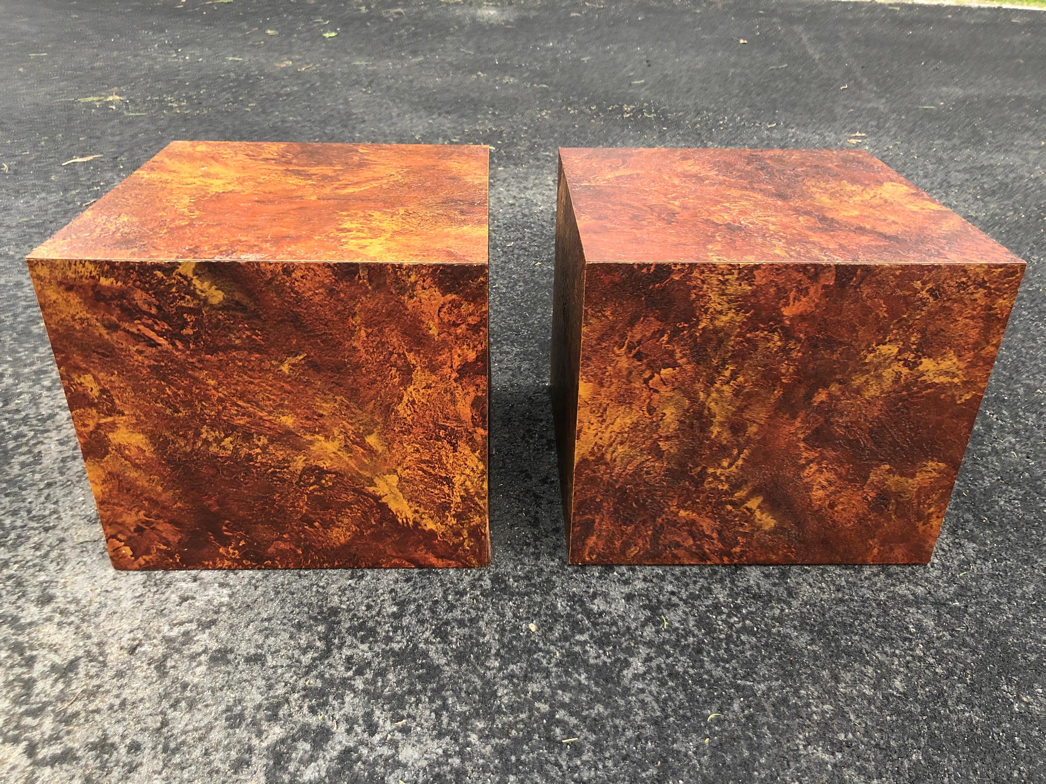 Pair of Mid-Century Modern cube tables in the style of Paul Evans. Deep earth tones make up this pair. Perfect for nightstands or end tables. Price is for the pair, not per item. Please request an updated parcel quote as these are inaccurate . 