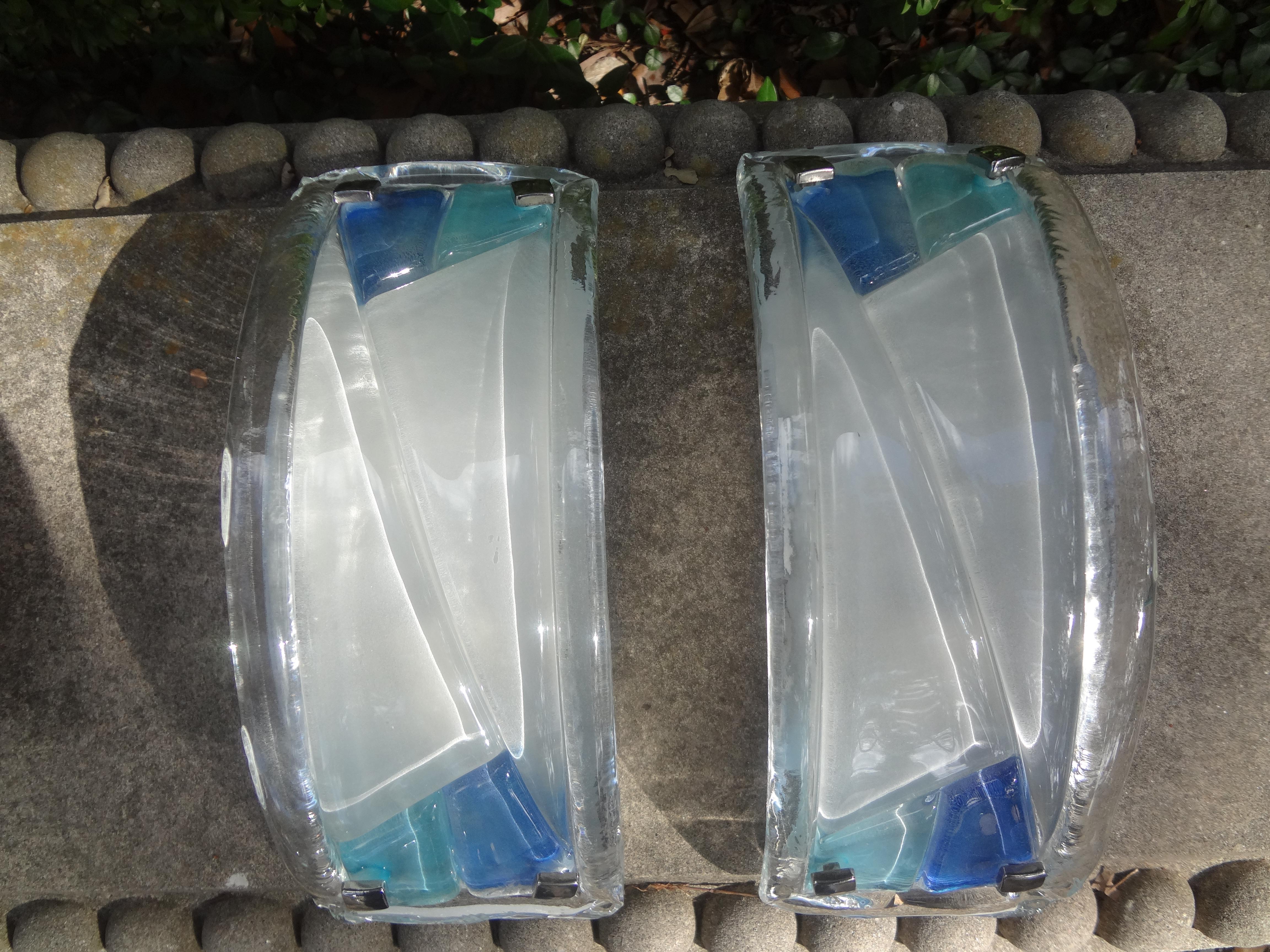 Pair of Mid-Century Modern Cubist Murano sconces.
Stunning pair of Mid-Century Modern cubist style Murano sconces. These gorgeous sconces are comprised of thick opaque Murano glass with blue and turquoise geometric designs made by Murano 5. These