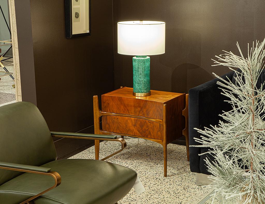 These beautiful original Mid-Century Modern nightstands are curved, Mid-Century Modern in design and were made by William Hinn in the 1950s. Made in the USA, these nightstands are crafted from walnut wood with beautiful wood grains and iconic