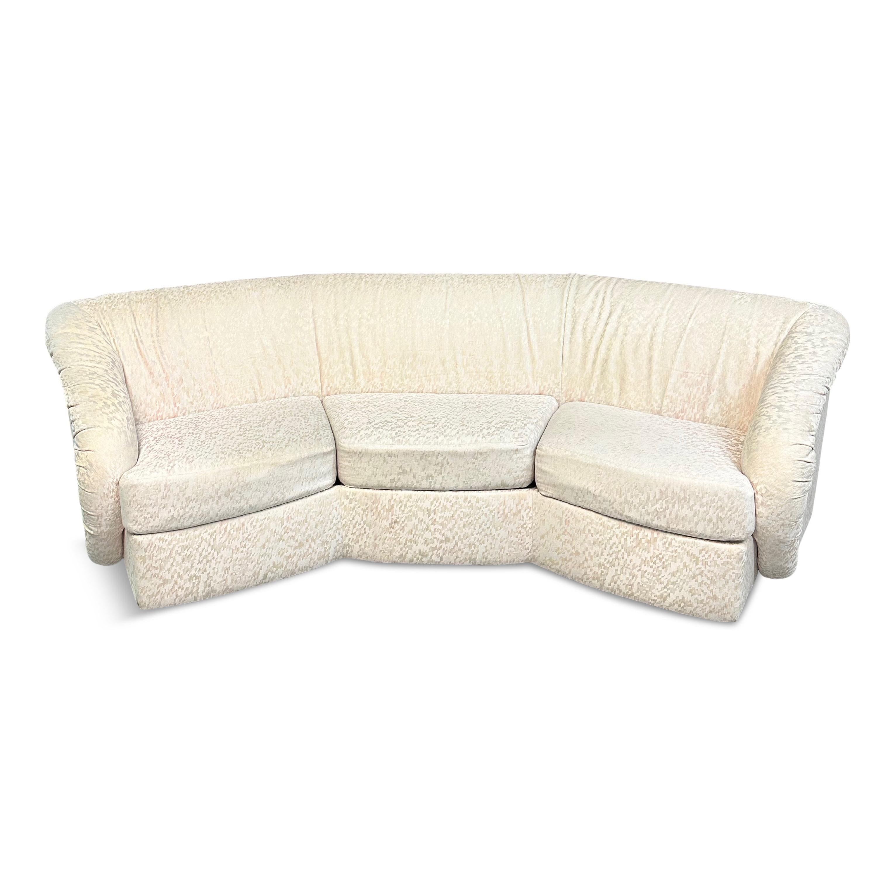 This pair of mid-century modern sofas offers a distinctive silhouette with its curved octagonal shape and sculptural arms. Inspired by 1980s design, these pieces are an excellent choice for those who want to add style to any living room.

These