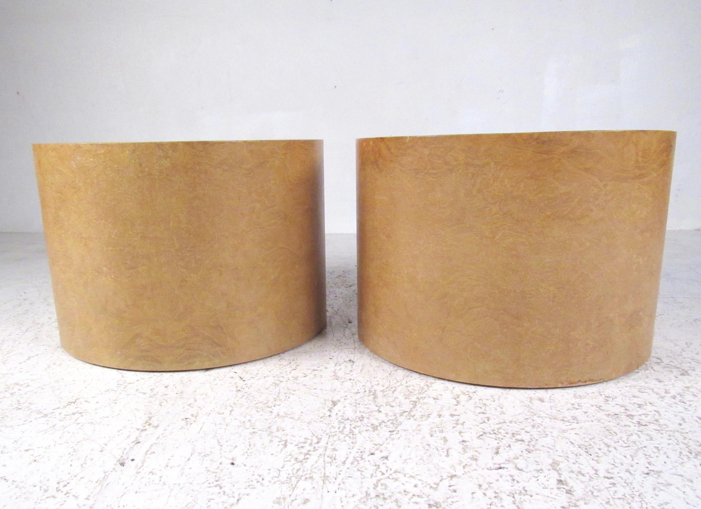 This stylish pair of vintage modern end tables feature a maple burl finish and cylindrical design of Intrex furniture. The unique style of the pair make them an elegant addition to home or business setting as end tables or pedestals. Please confirm