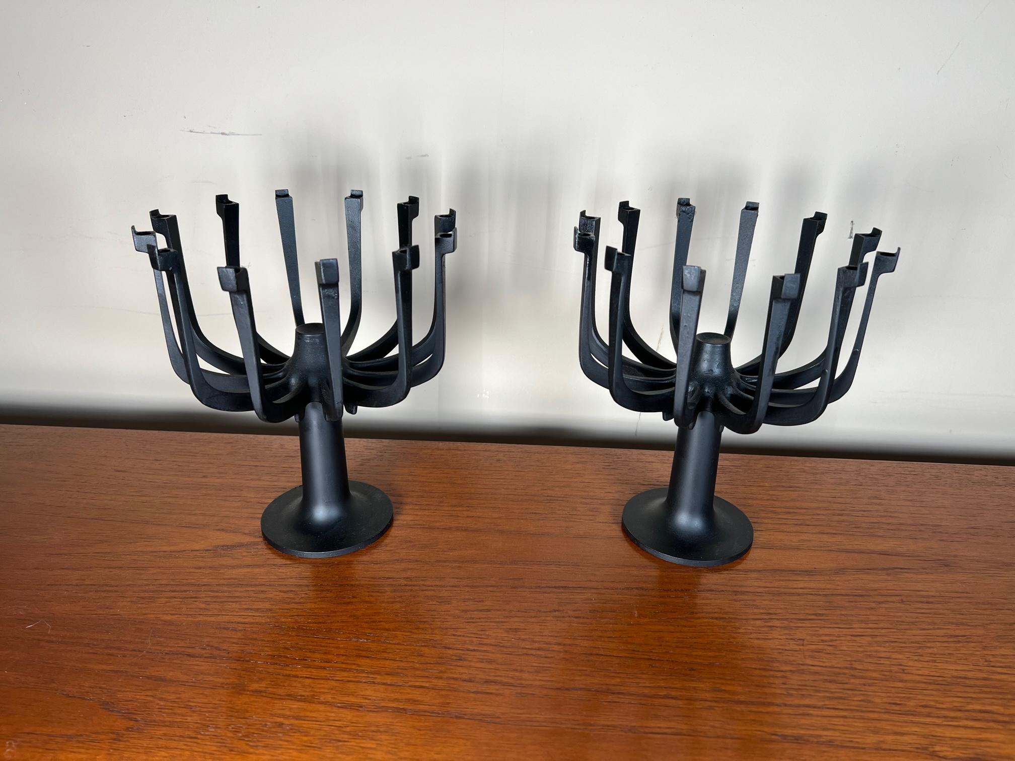 Pair of cast iron candleabras by Gunnar Cyren for Dansk. Stamped underneath. Holds 12 thin candles each. Candles not included.
Very good condition. Minor wear. Last photo is for display only. Credenza and painting not included.
Dimensions: 7