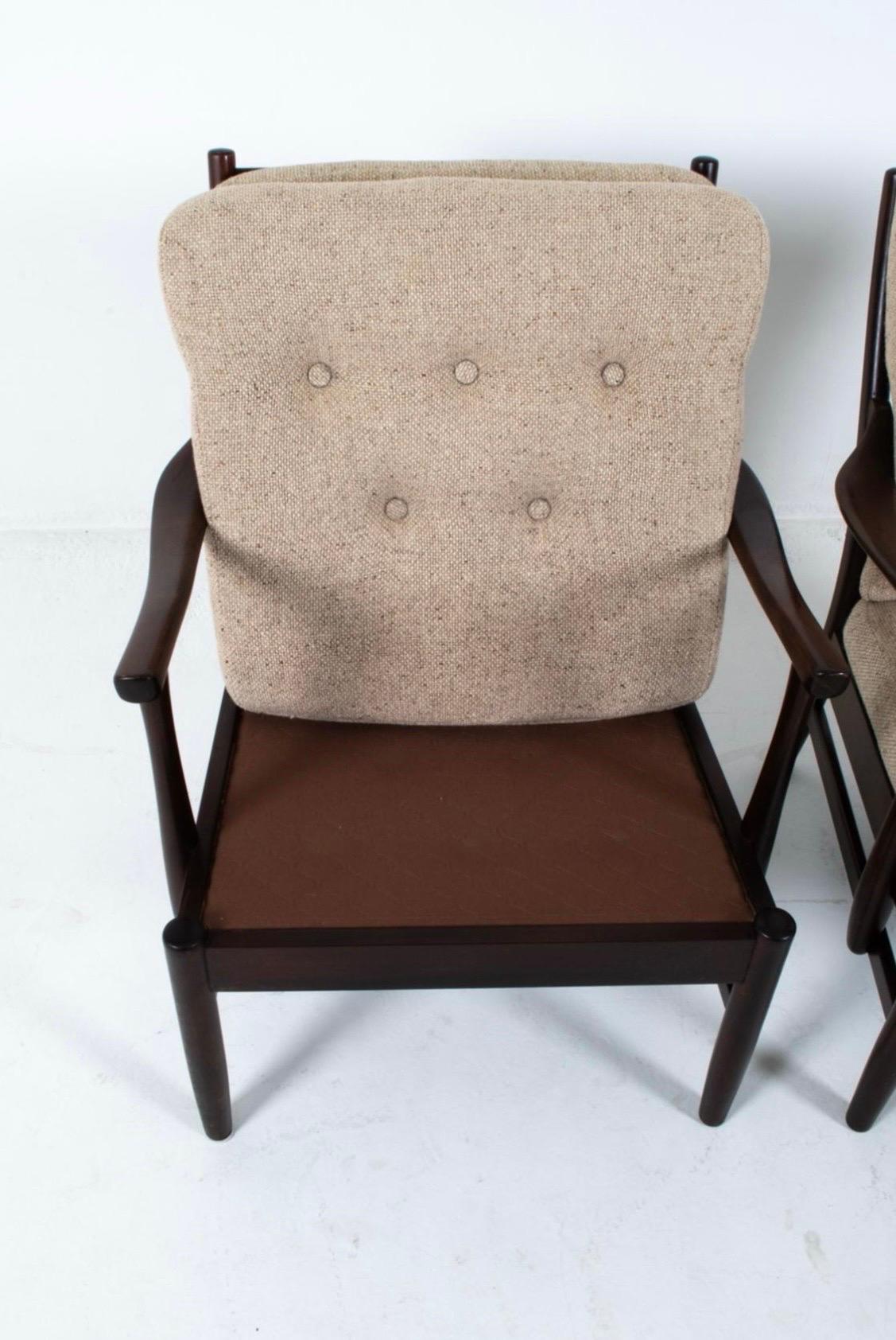Classic and iconic mid century Farstrup lounge chairs with rare espresso stained beechwood frames and upholstered in a neutral wool tweed upholstery.  Great lines, better scale and incedible comfort.  Why not own the best?