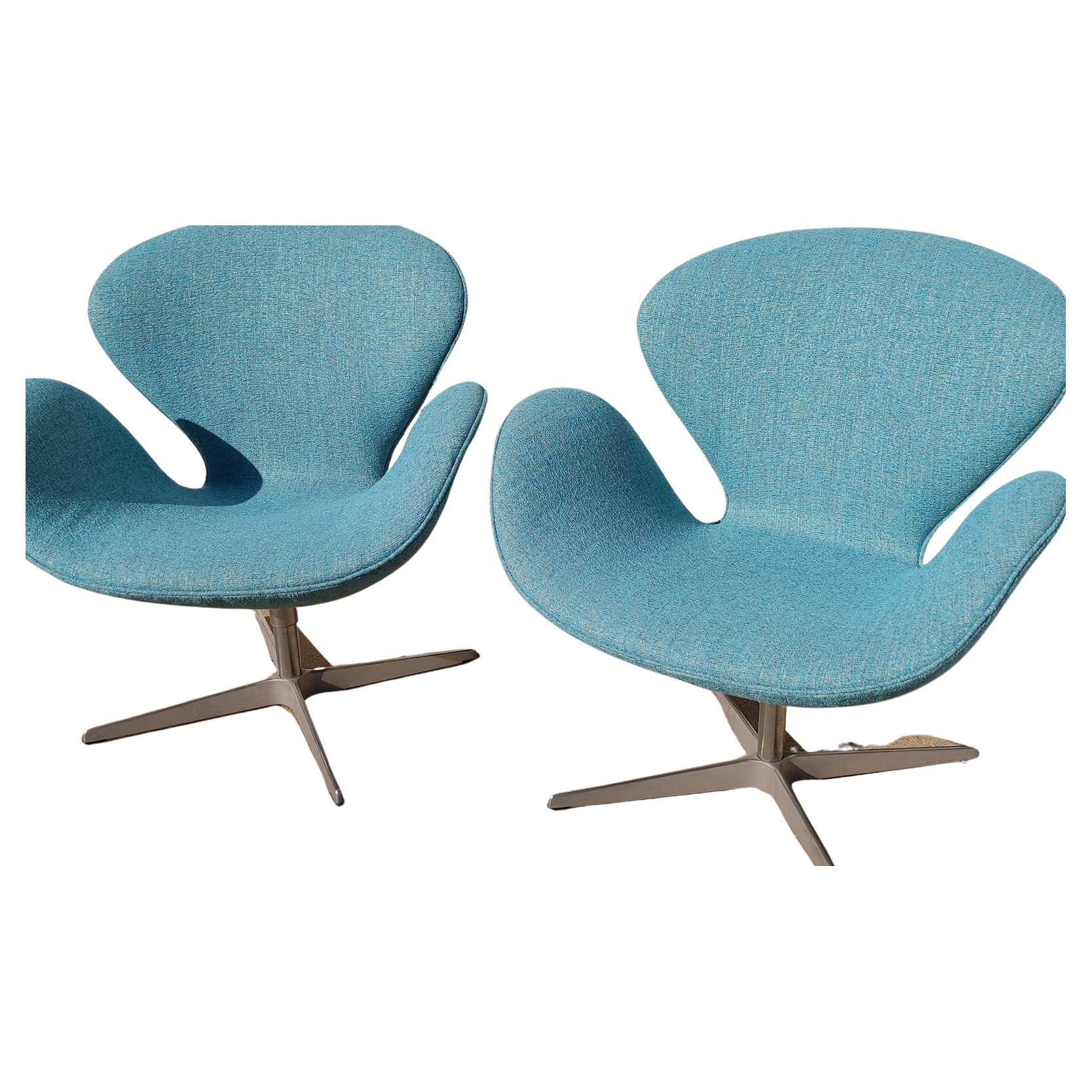 Pair of Mid Century Modern Danish Modern Arne Jacobsen Swan Chairs

Sold as pair. Above average vintage condition and structurally sound. Has some expected slight wear on bases. Upholstery is new. Outdoor listing pictures might appear slightly