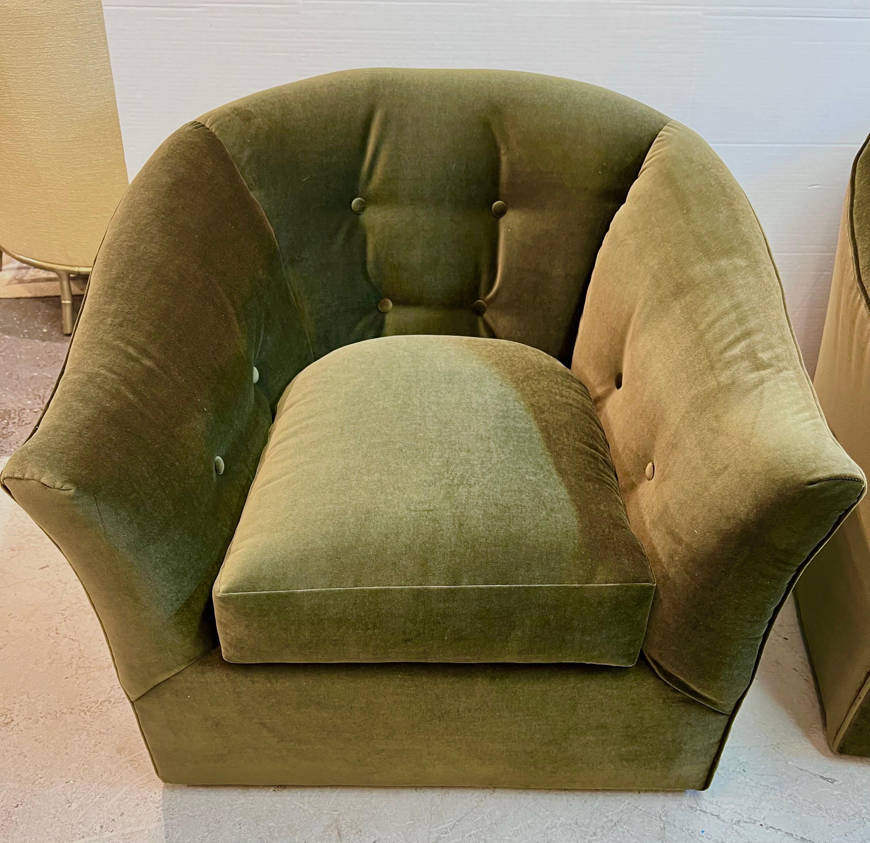 Magnificent pair of newly reupholstered dark olive tufted club chairs. The fabric is a velvet mohair. Features 8 way hand tied construction and gorgeous lines. The scale is perfect for a larger home or apartment. Why not own the best?.