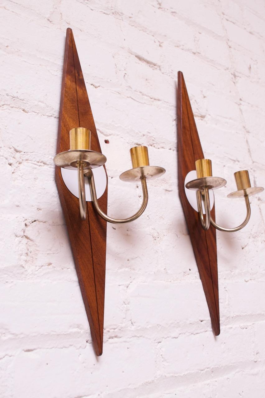 Walnut sconces / candleholders with painted brass circular components and brass candleholders (two / sconce). Elegant, diamond form.
Nice, vintage condition with tarnish to the unpolished brass, as shown.

  