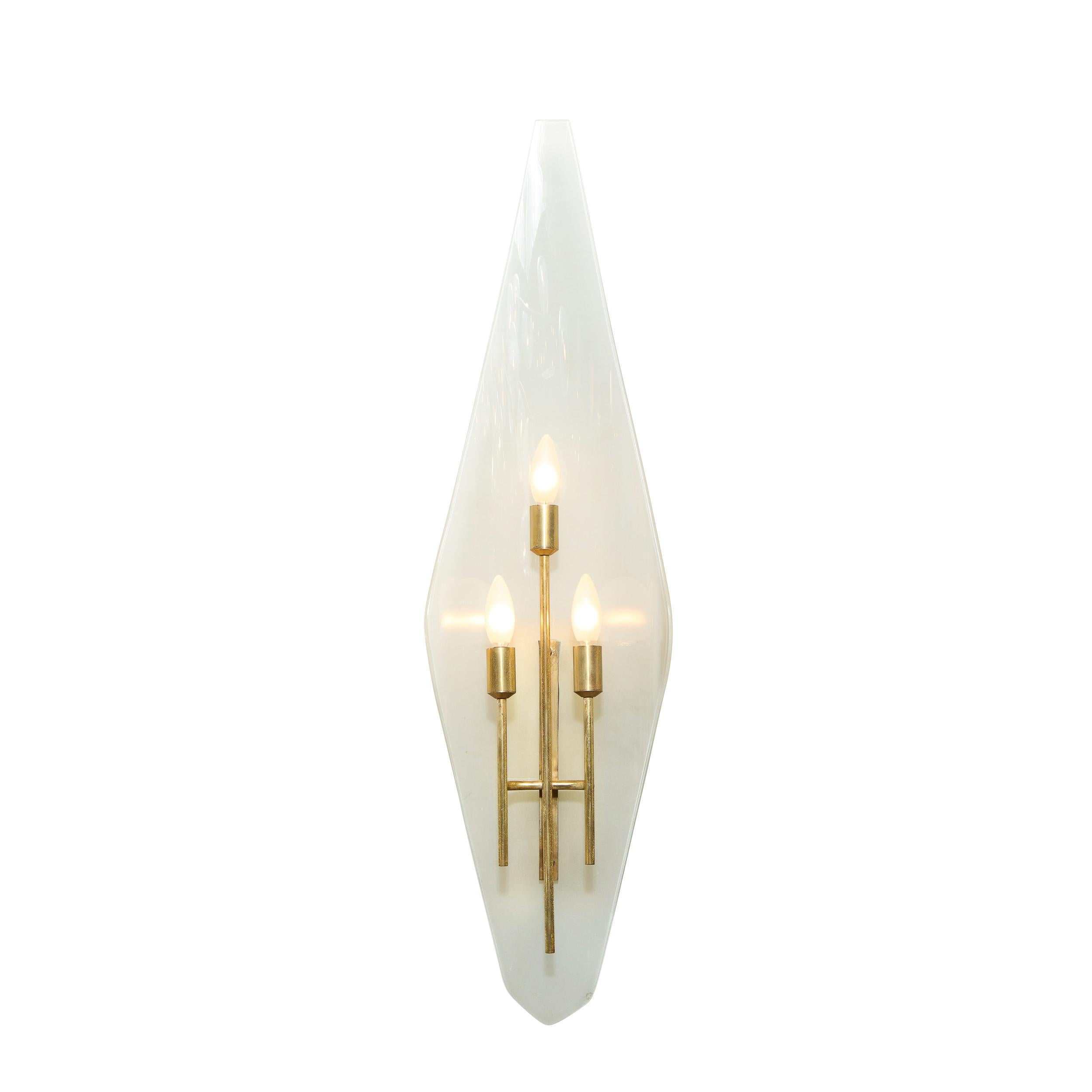 This stunning and graphic pair of Mid-Century Modern sconces were realized in Italy, circa 1960, by the esteemed 20th Century designer Gio Ponti. They feature subtly concave amorphic diamond form shades with flat tops and beveled bottoms. The