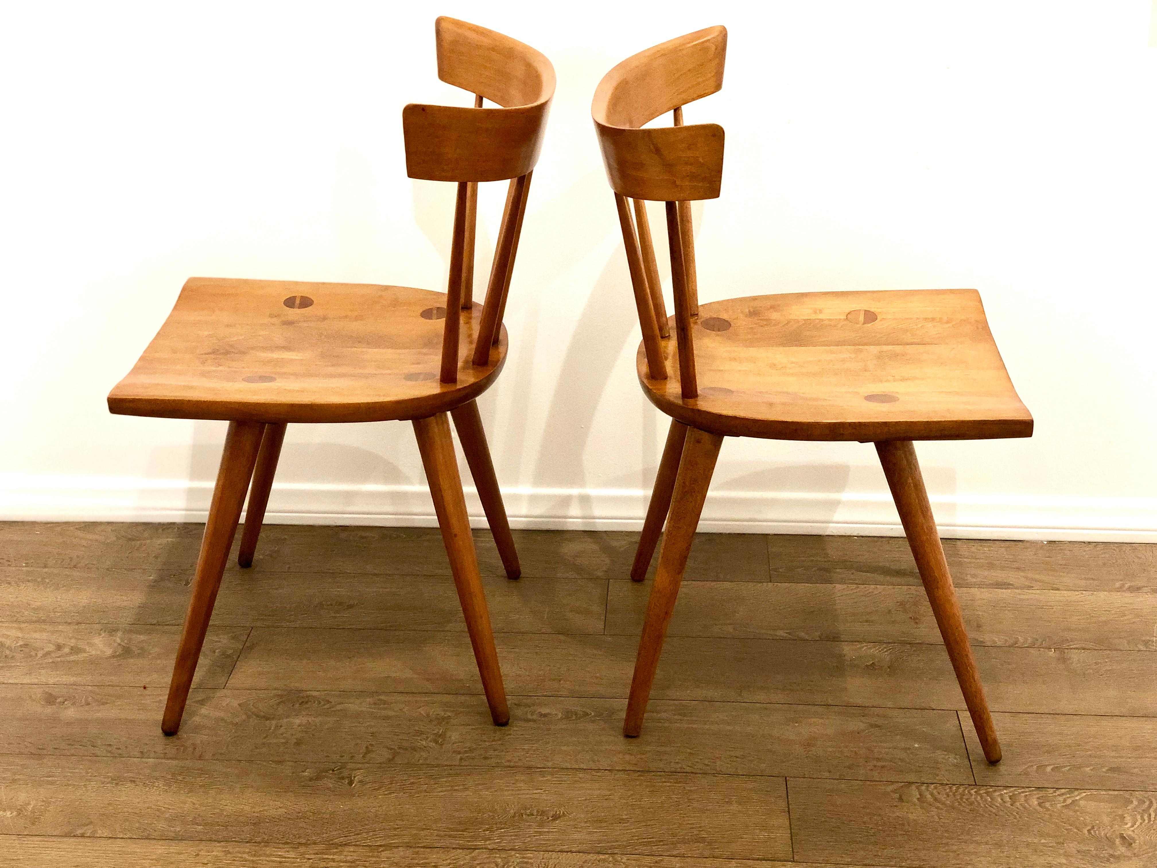 Pair of Paul McCobb Planner group side chairs, circa 1955. Professionally restored and refinished solid and sturdy, with original honey finish. Great to add to your current set, or mix and match for an eclectic look. Excellent vintage condition.