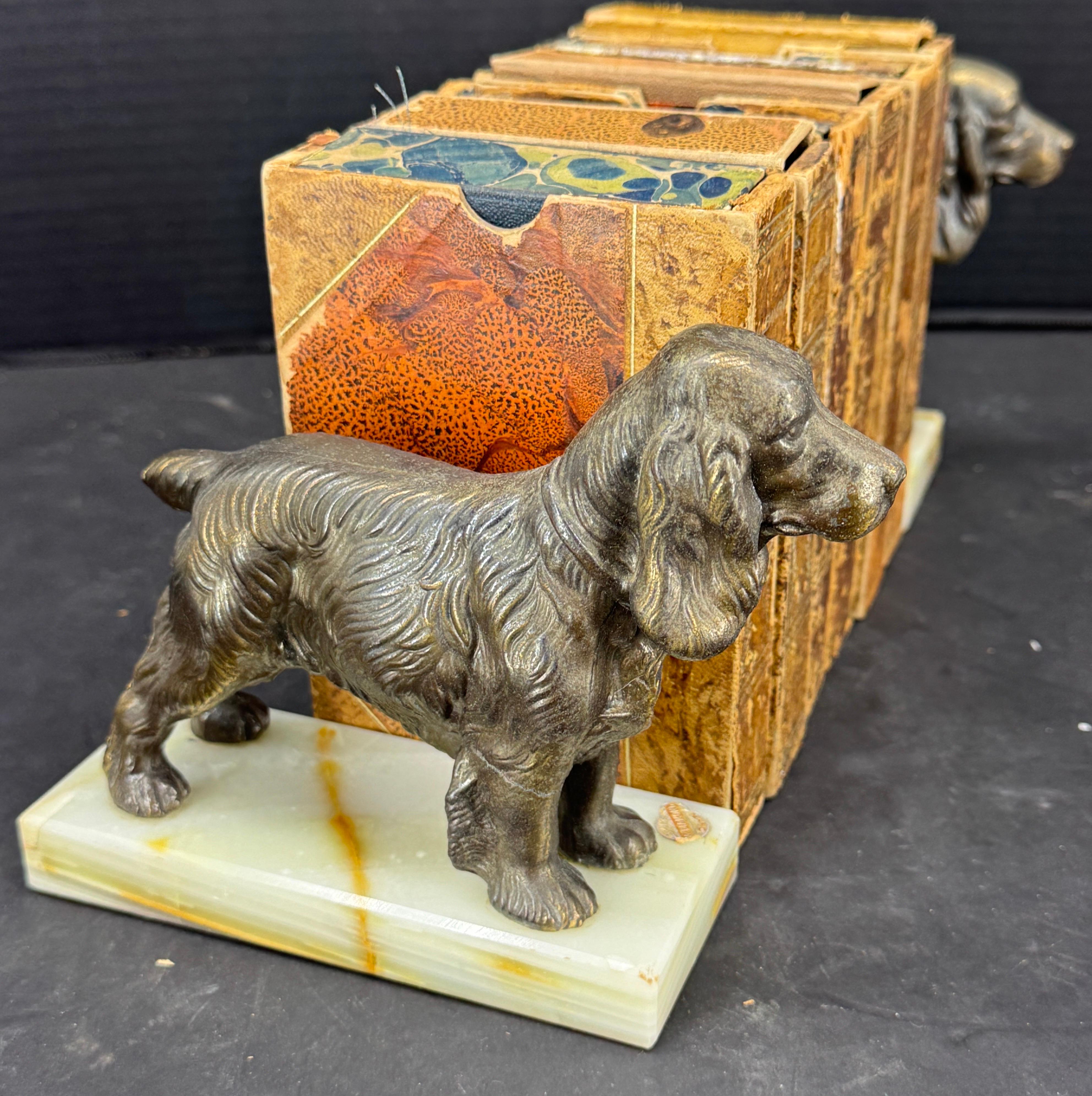 Pair of Mid Century Modern Dog Book Ends on Onyx Bases. We see this set added to a current collection or resting on a bookshelf in a home library. Wonderful set to give a gift or keep for yourself.

Sticker with 