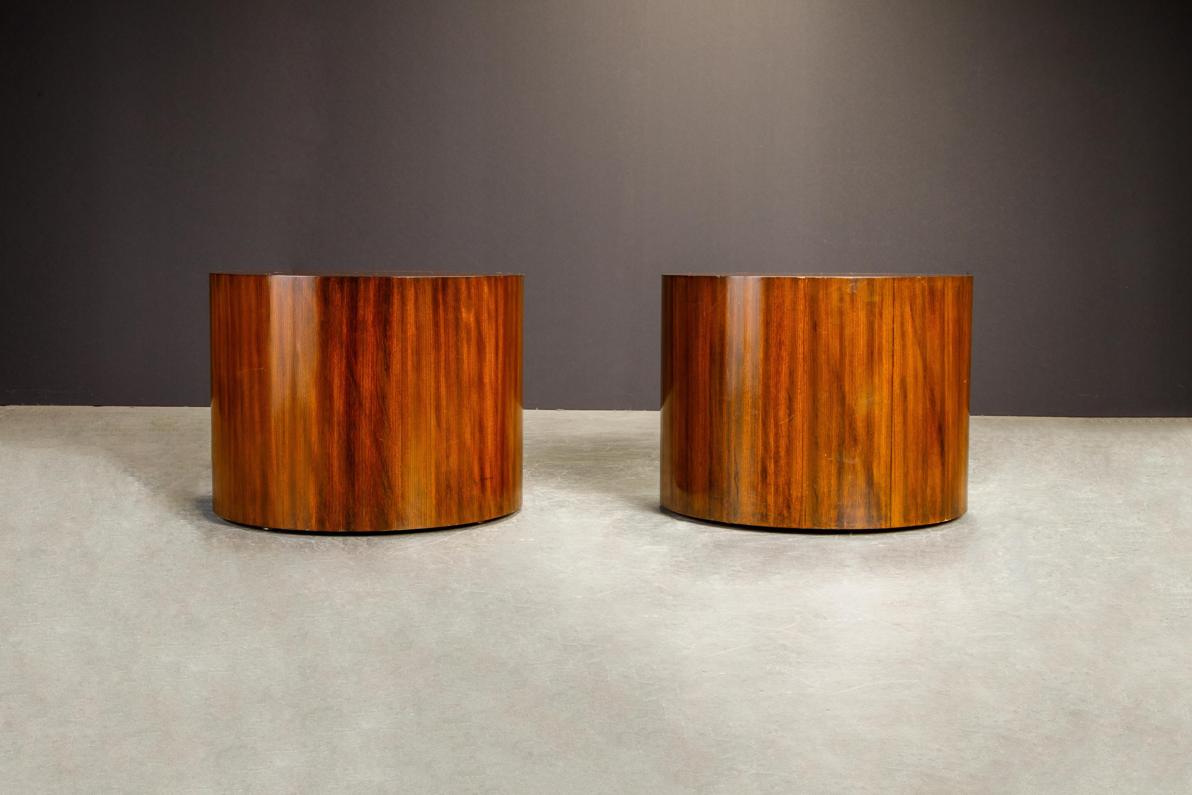 A pair of charming drum form wood tables in the style of Milo Baughman, circa 1970s, great as side tables, end tables, occasional tables or pedestals for sculptures. 

These cylinder pedestals / occasional tables would work great in a Mid-Century