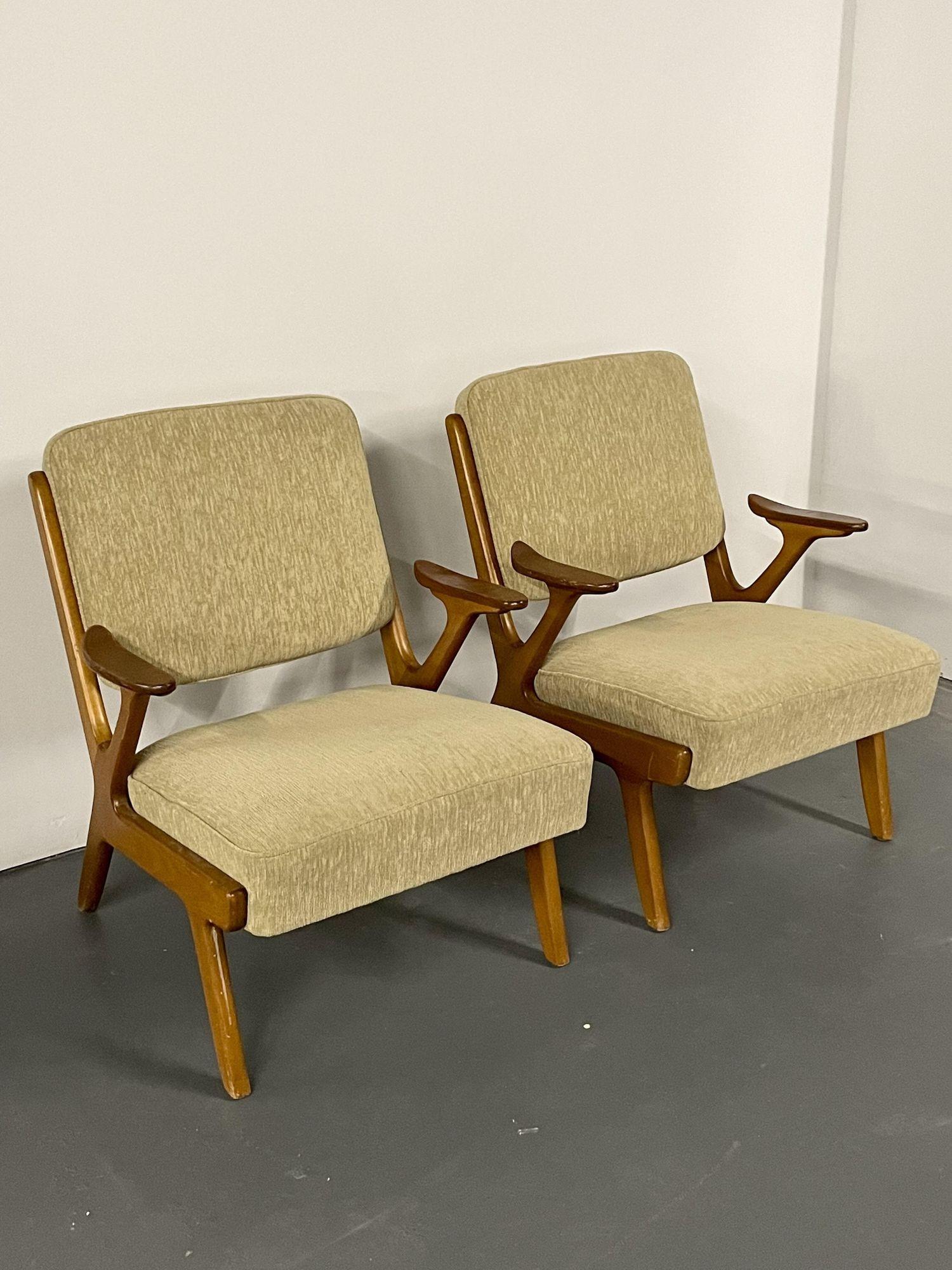 Pair of Mid-Century Modern easy / lounge chairs, Sweden, 1960s. 
 
Unique organic form Swedish designer lounge or arm chairs from the 1960s for Swedish manufacturer Svegards Makaryd.
 
Other Scandinavian designers of the period include Finn Juhl,