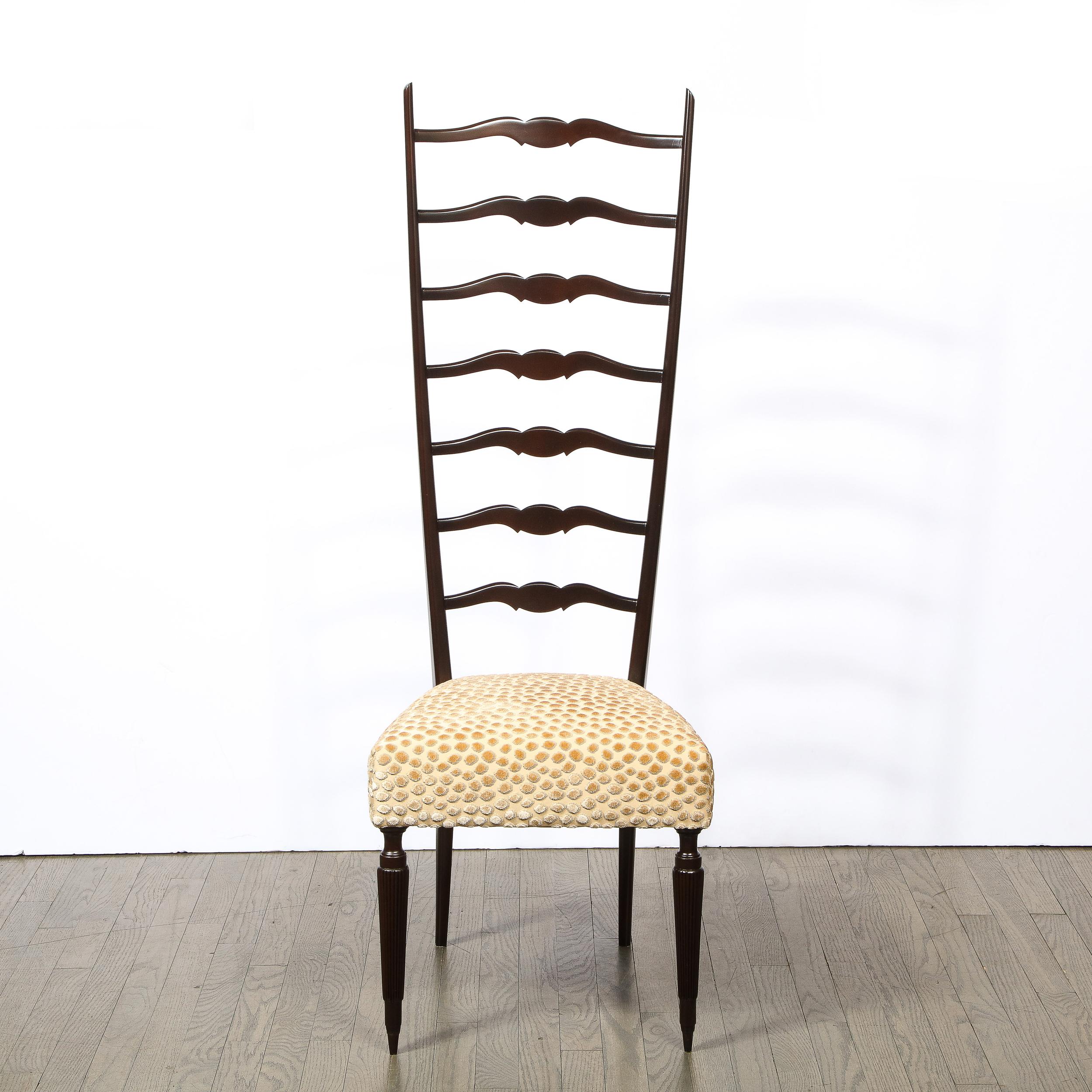 This graphic and sophisticated pair of Mid-Century Modern ladder back chairs were realized in Italy, circa 1950. These are a rare version of the Italian ladder back chair- popularized by iconic designers such as Gio Ponti- exhibiting an exquisite
