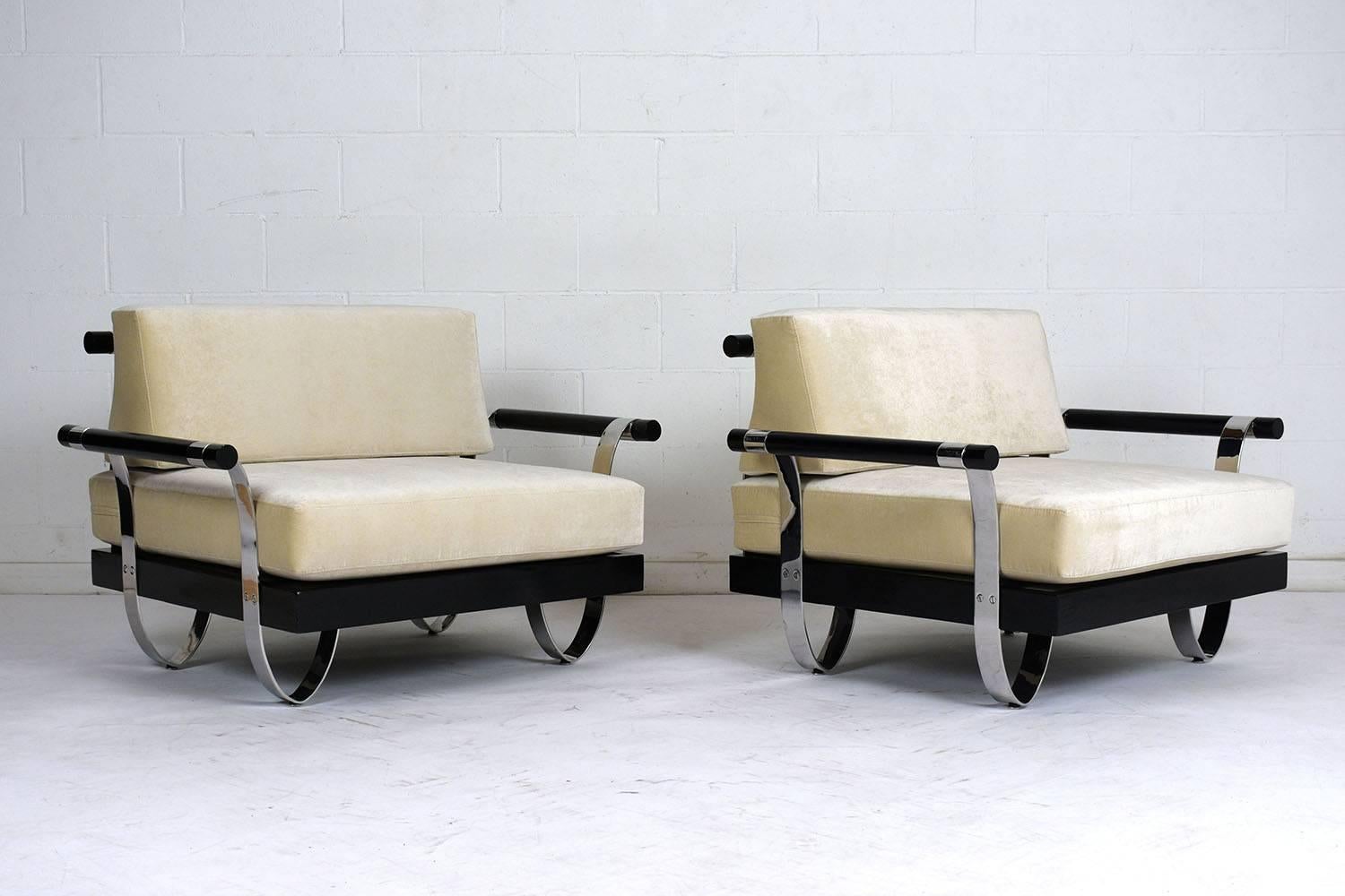 This pair of 1960s Modern-style lounge chairs features ornate polished chrome legs and back rest which are screwed on to a beautiful black finished base. The legs go up and connect with the armrest. The chairs have been professionally reupholstered
