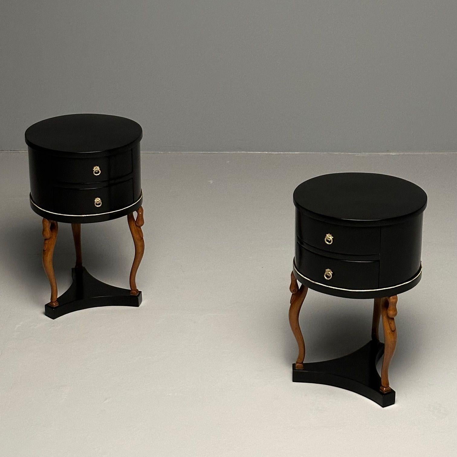 Empire Style, Mid-Century Modern, Side, End Tables, Mahogany, Swan Motif, Italy

Each having a circular two drawer drum top supported by a tripod base with full bodied swan carved legs in their original wood finish. Each drawer having a star shaped