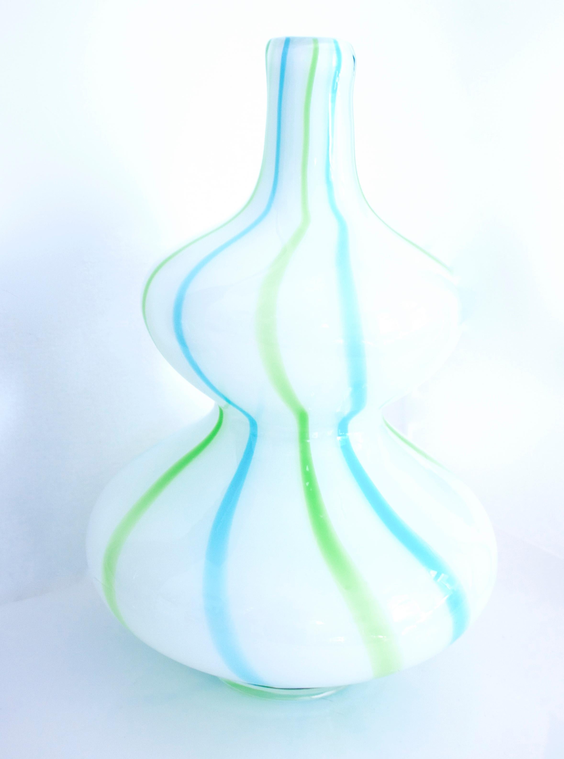 Empoli cased glass popular during the 1950s-1960s, when they began to produce brightly, vibrant glass cased comprising a layer of clear glass and an internal layer of opaque white 'Lattimo glass. The double hooped vase by Vetrerie di Empoli is