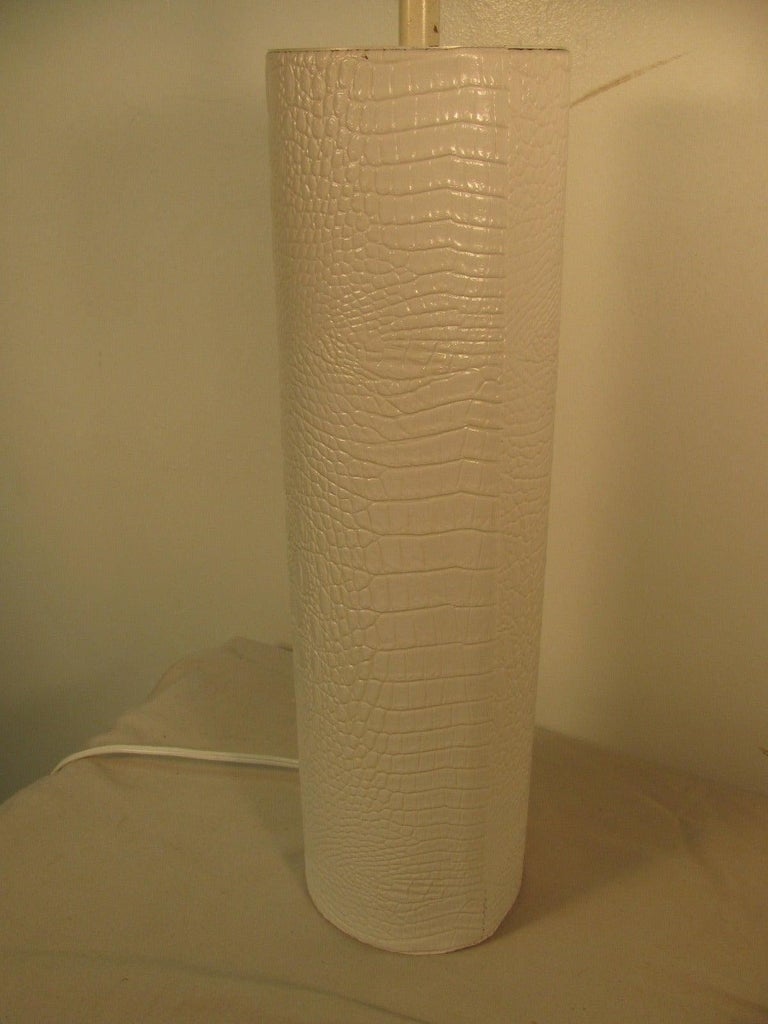 Elegant and simple pair of table lamps in faux white crocodile. 22 in. to top of the socket.