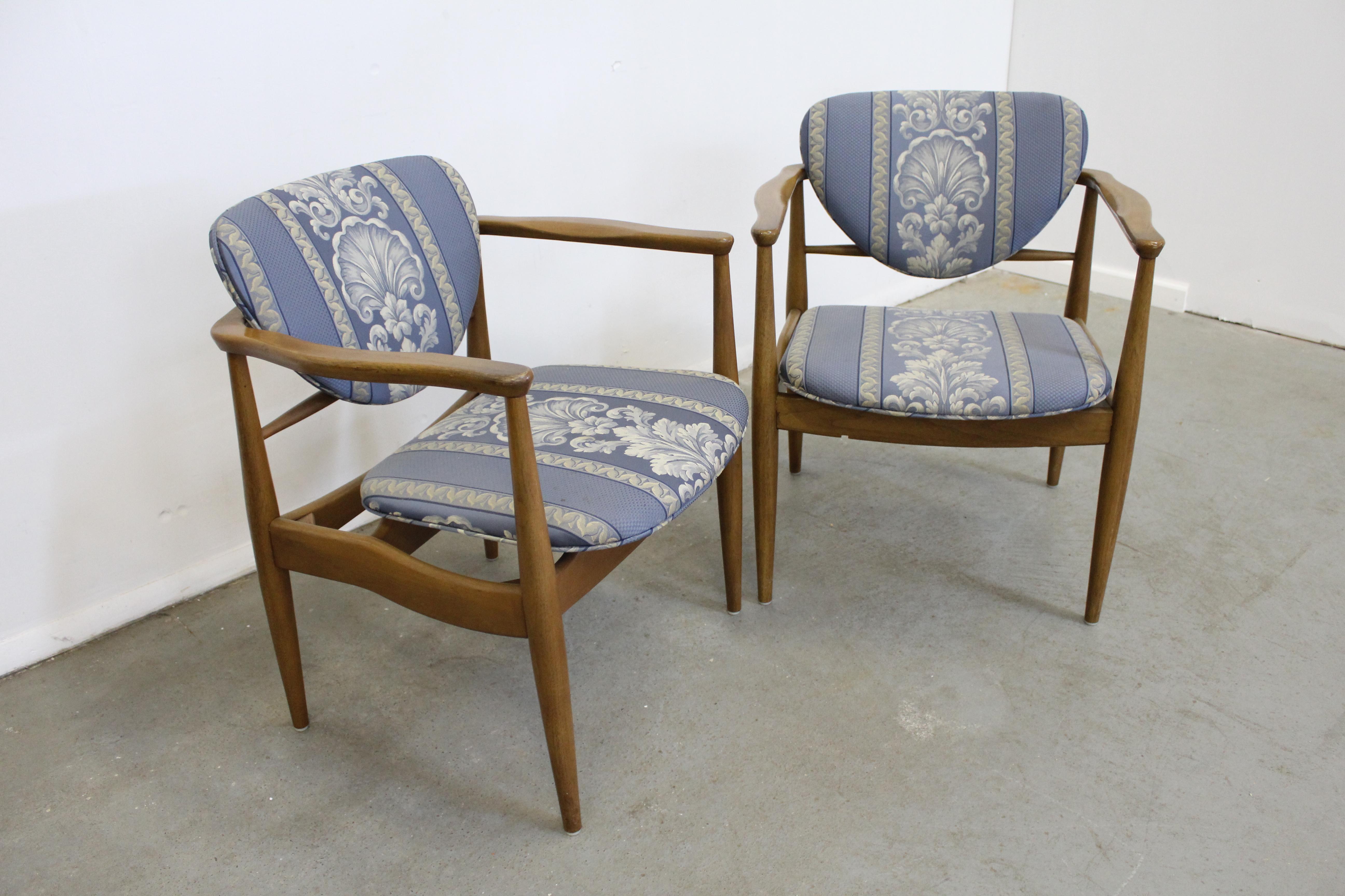 Pair of Mid-Century Danish Modern John Stuart Finn Juhl walnut armchairs
 
Offered is a pair of Mid-Century Modern arm chairs attributed to Finn Juhl. Look to be walnut and have been reupholstered by their previous owner. In good, structurally