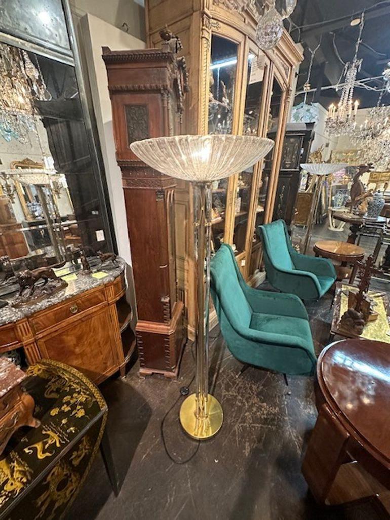 Lovely MCM modern brass and Murano glass floor lamps. Makes and elegant statement! Circa 1970. Note: Price listed is for 1.
