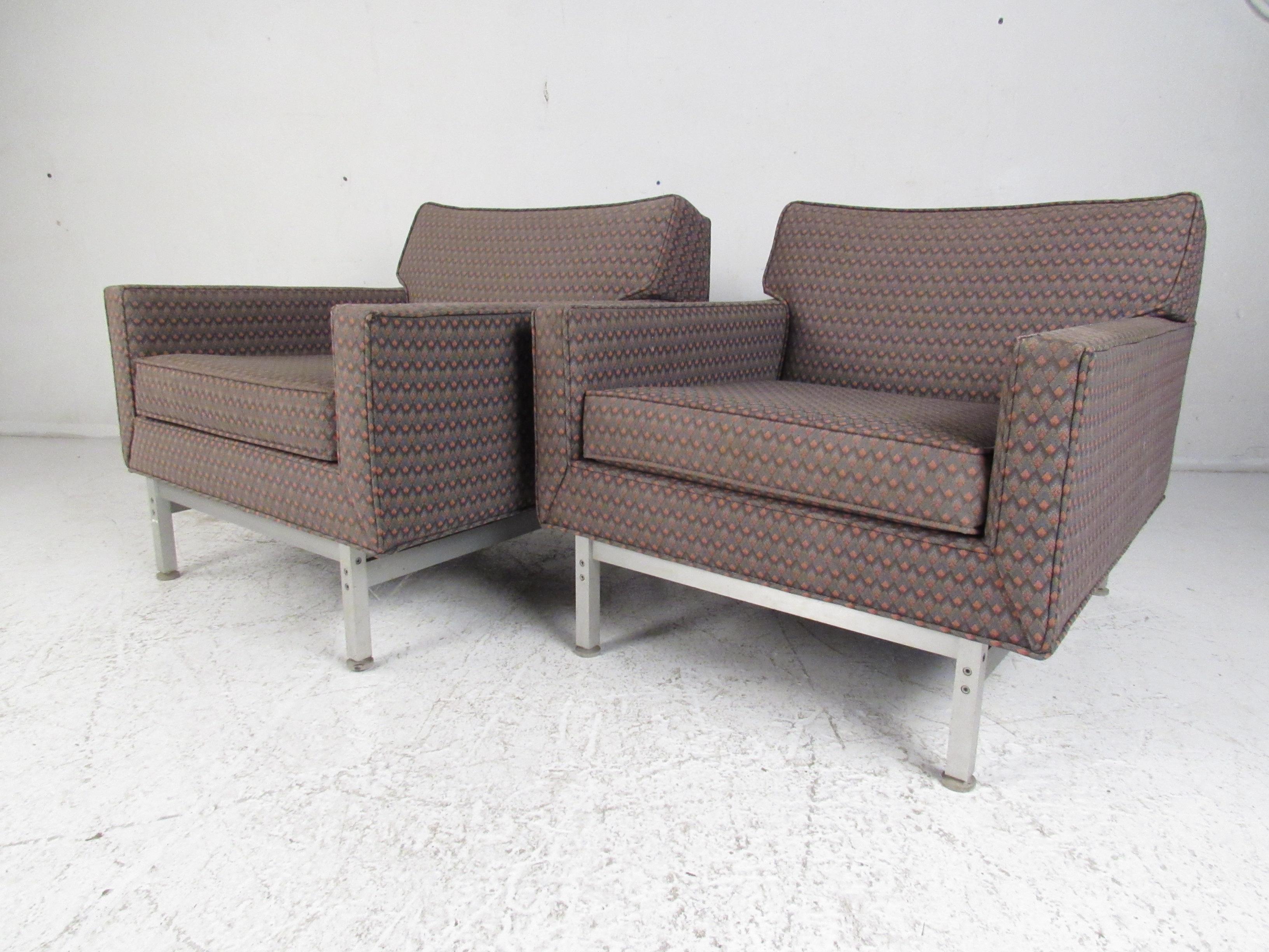 This stylish pair of vintage modern chairs by Knoll International makes the perfect eye catching addition to any modern interior. An extremely comfortable design with low arm rests and an overstuffed removable cushion. This low sitting pair of