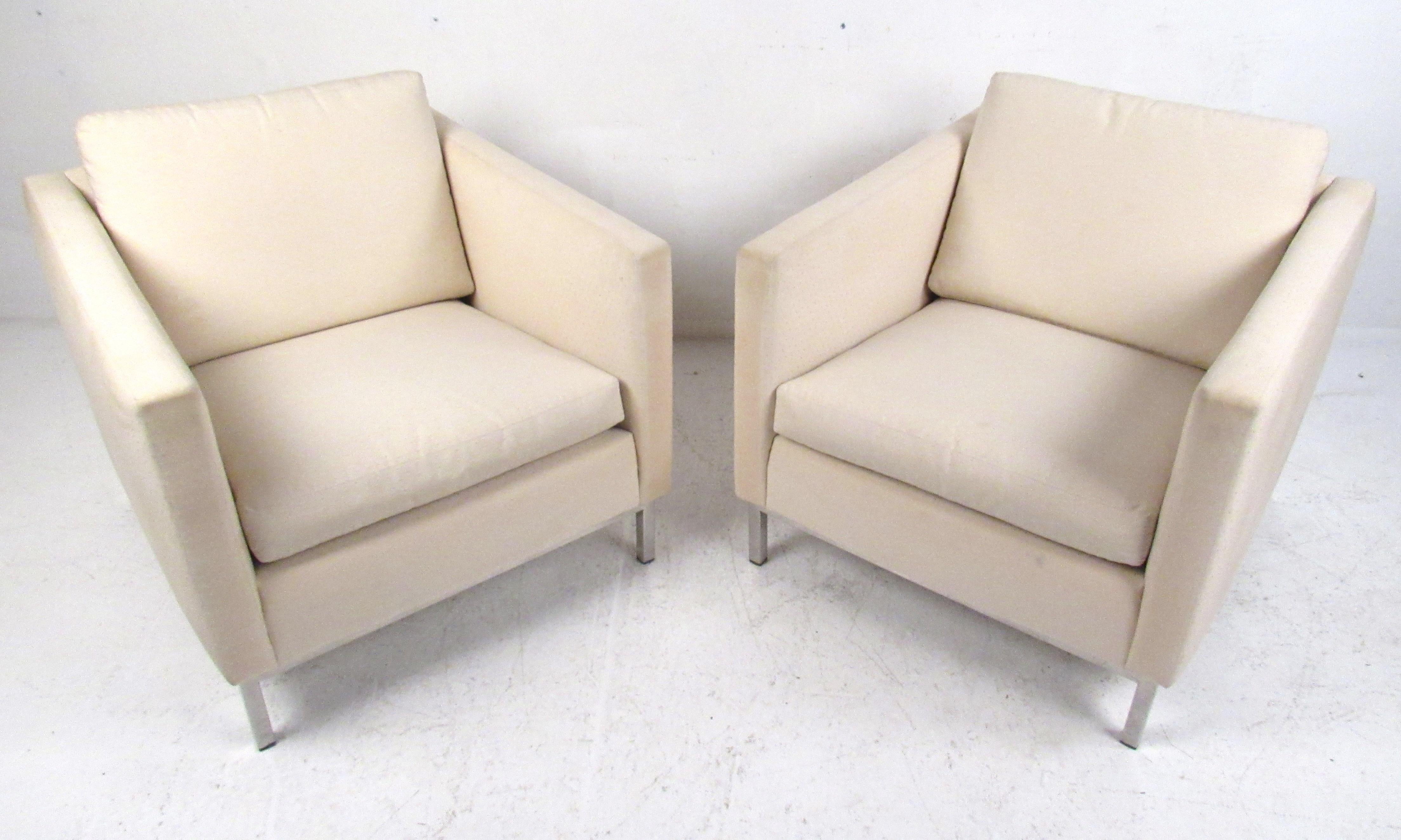 This stunning pair of lounge chairs feature a heavy chrome frame and an overstuffed removable cushion. A sleek and comfortable design that is sure to complement any seating arrangement. Please confirm the item location (NY or NJ).