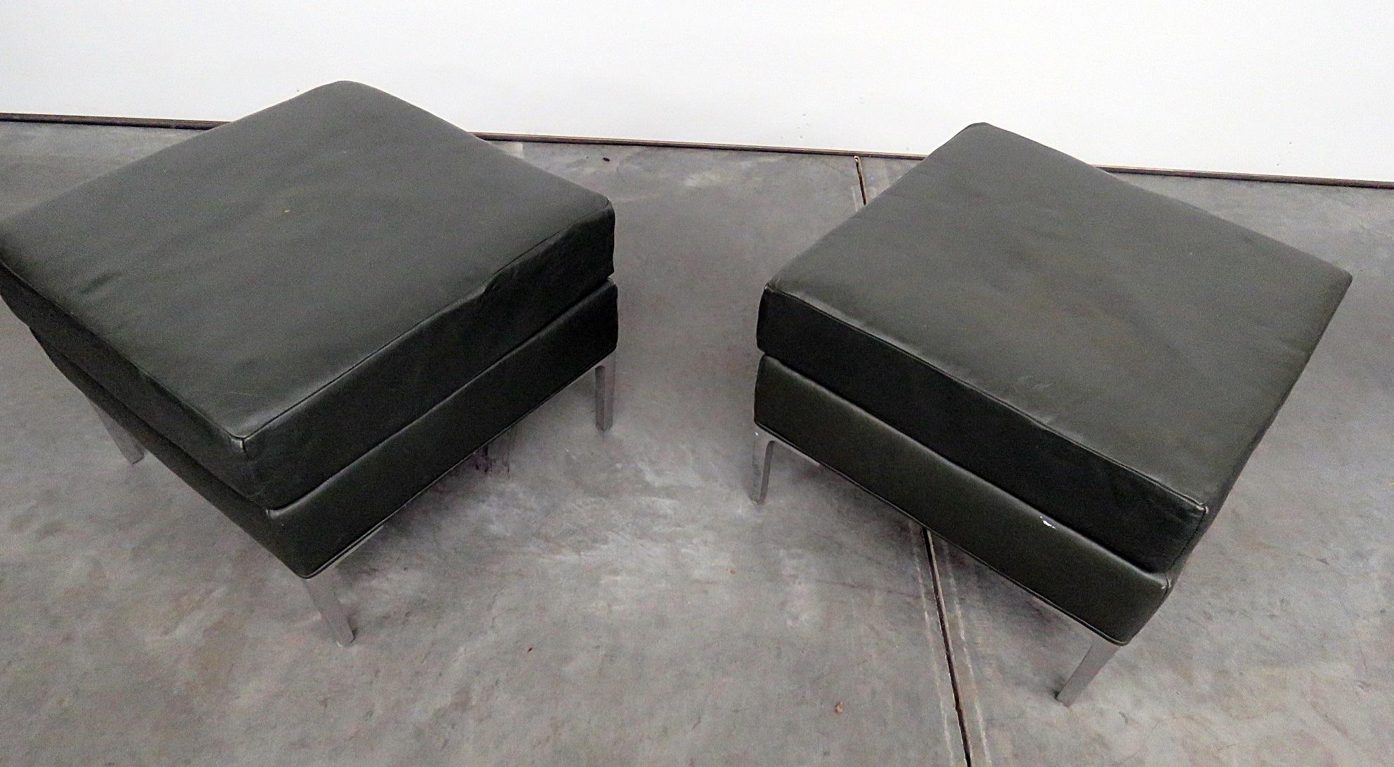 Pair of Mid-Century Modern faux leather footstools on silver gilt frames.