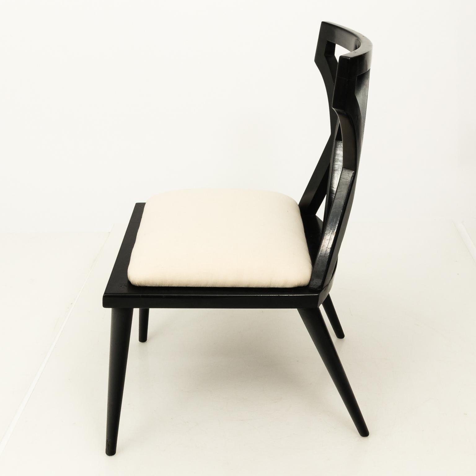 Pair of Mid-Century Modern French black lacquered side chairs, circa 1960s.
 