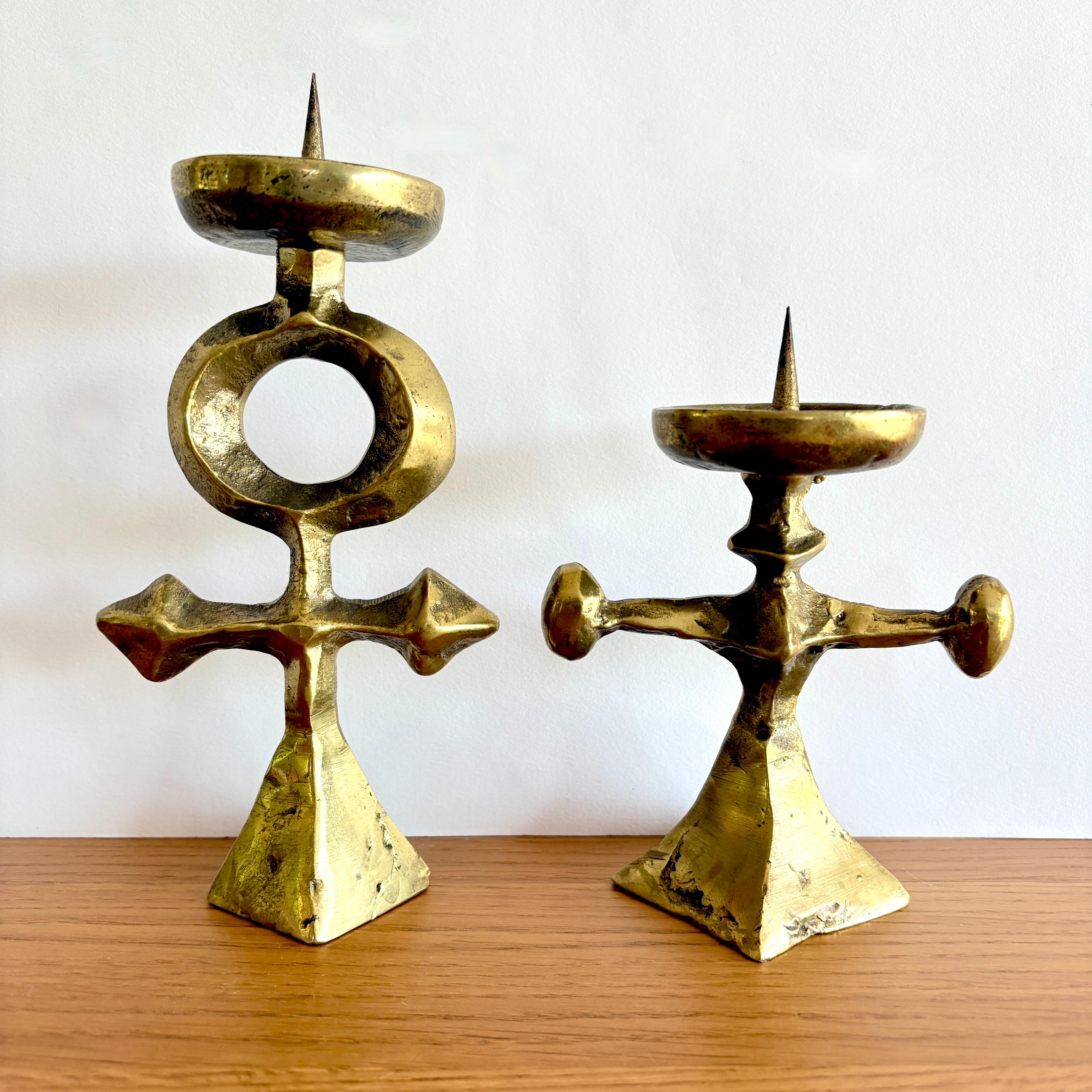 An unusual pair of mid-century modern bronze candle holders. These candle holders have a wonderful brutalist style and most likely date from around the 1960s. Great metalwork and definitely two-of-a-kind. The candle holders feature no maker's marks
