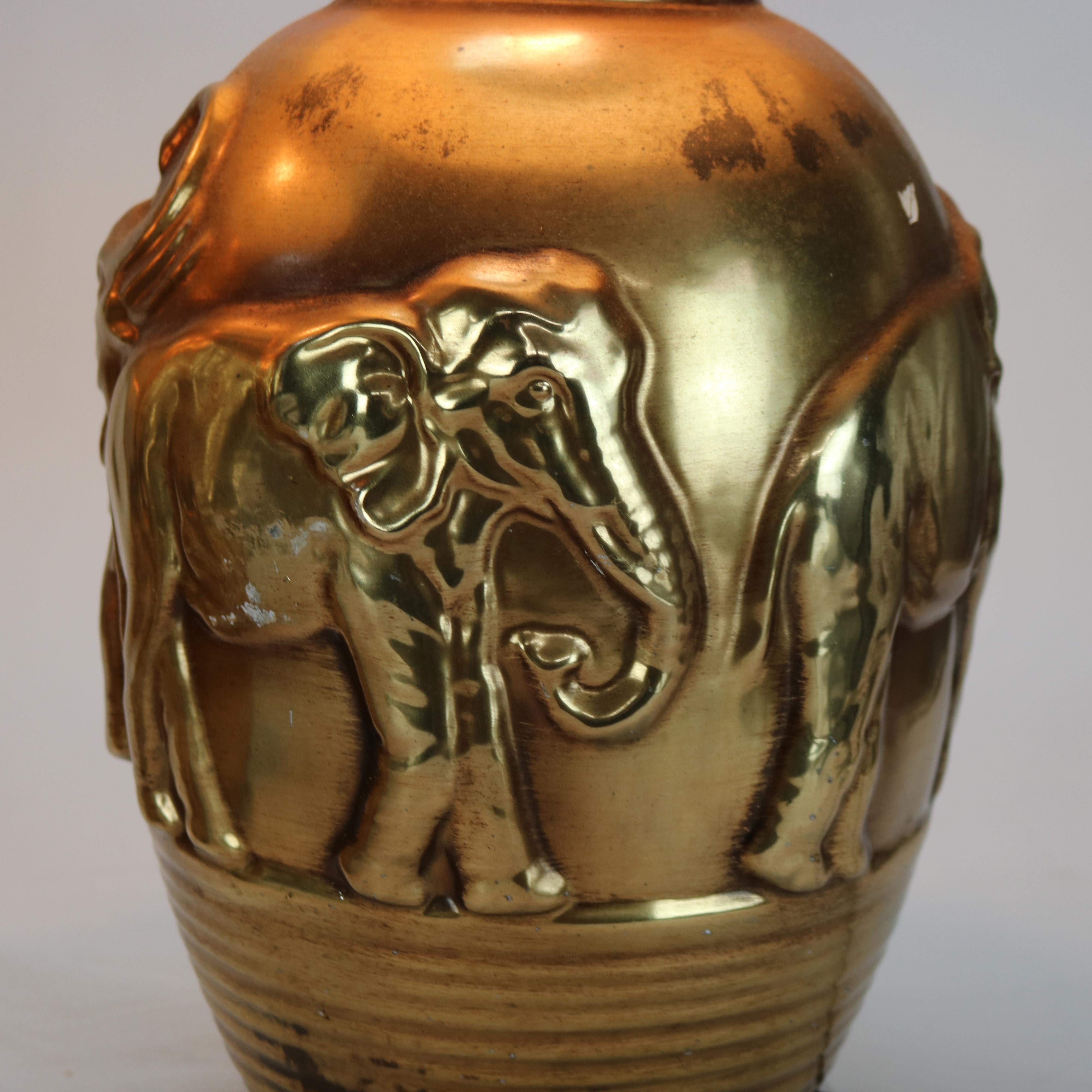 Pair of Mid Century Modern Gilt & Embossed Figural Elephant Pottery Lamps C1950.  

Measures - 29