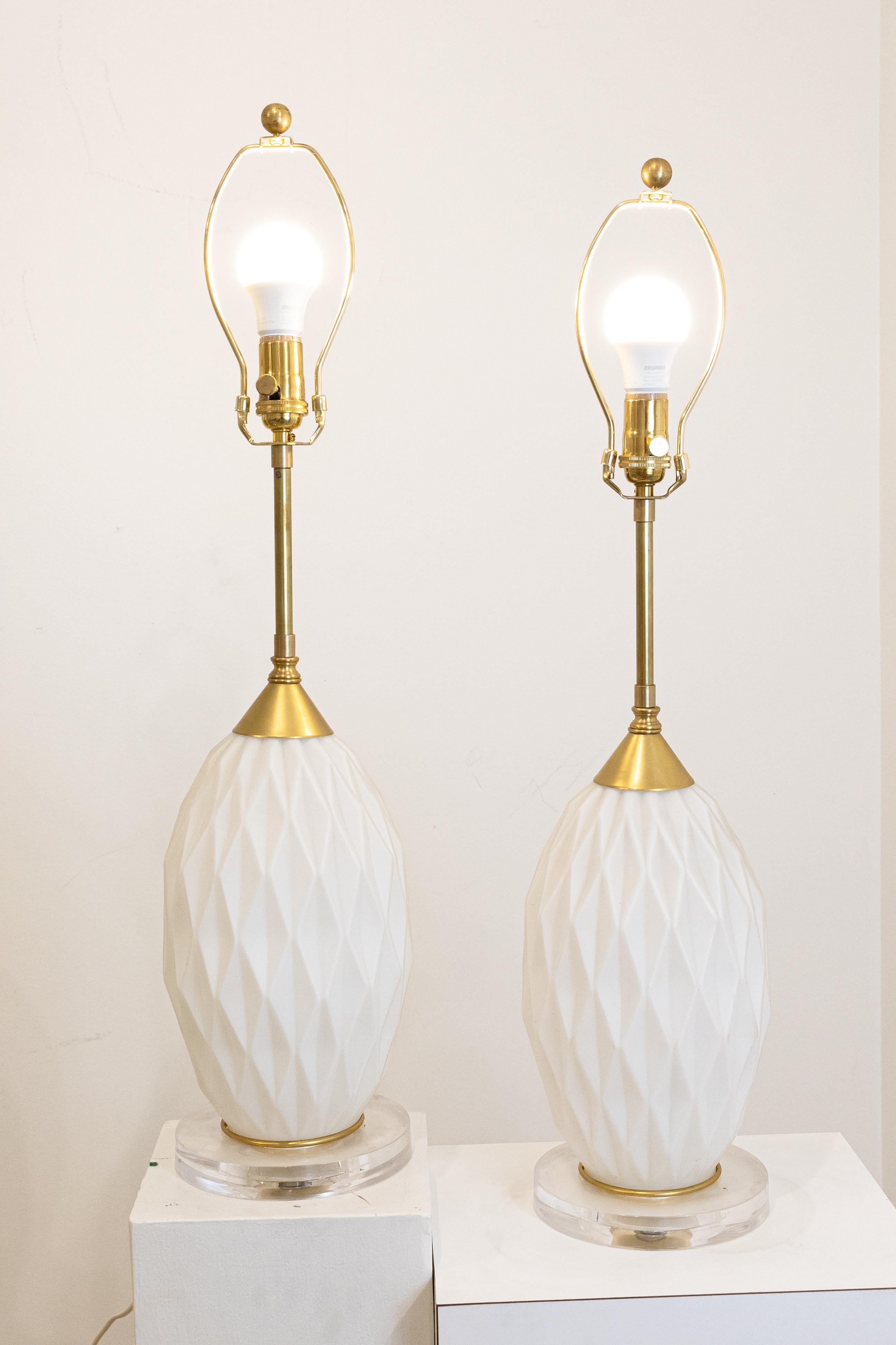 A pair of diamond cut glass, brass and lucite lamps in excellent condition. Dimensions: 7